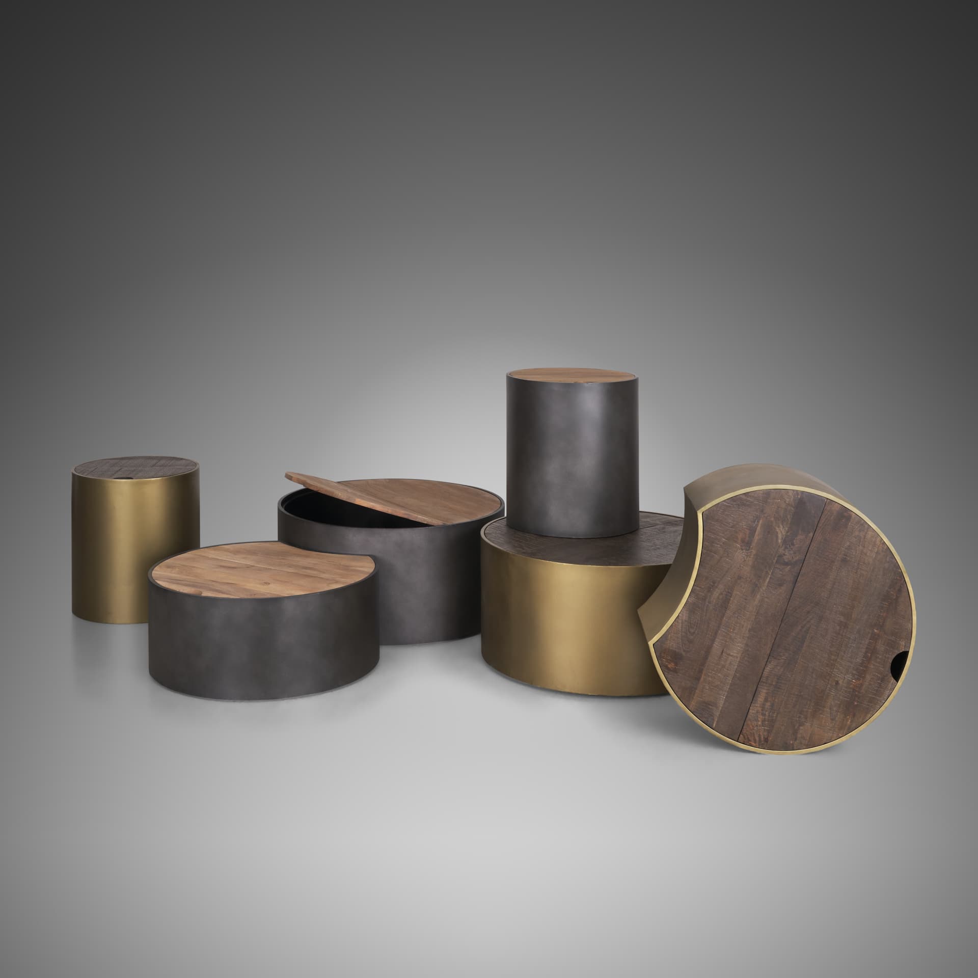 Eclipse Gunmetal Gray Drum Base w/ Brown Wood Top Nested Coffee Table — in a styled room