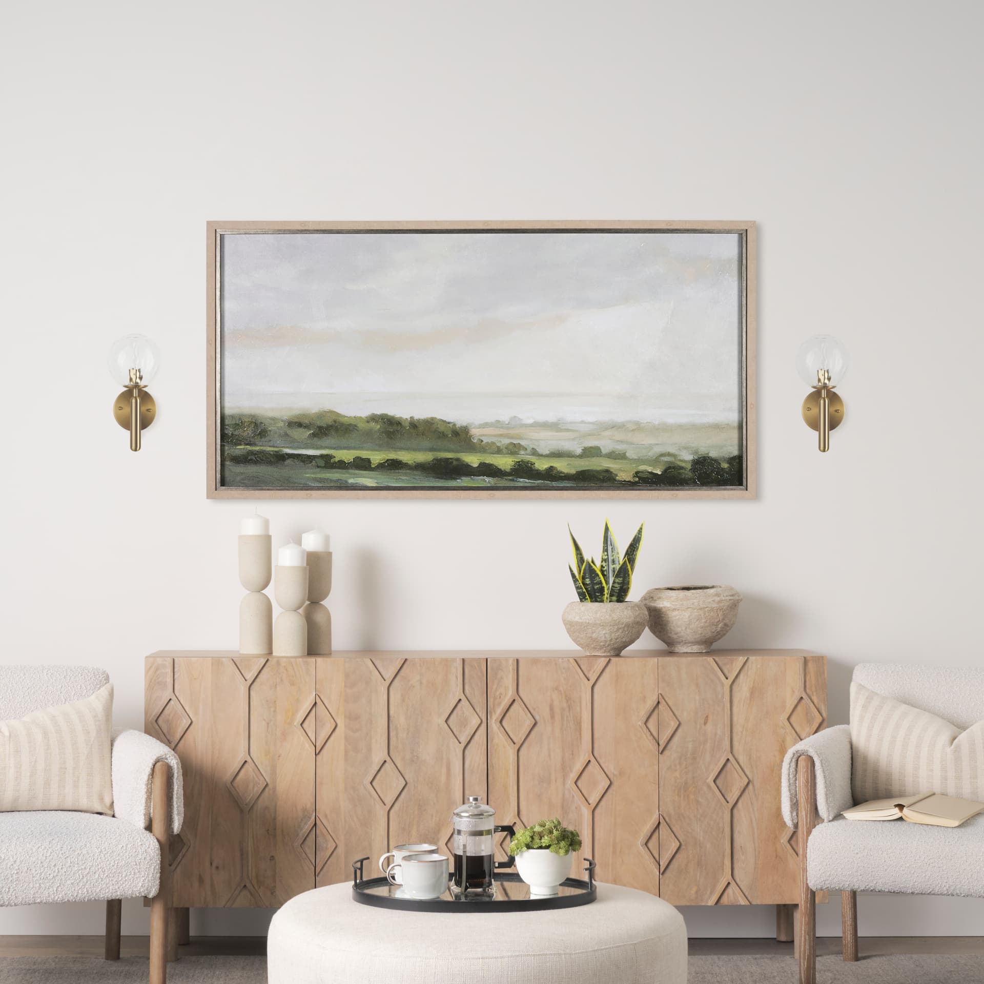 Britton Gold Metal w/ Clear Glass Globe 1-Light Wall Sconce — in a styled room