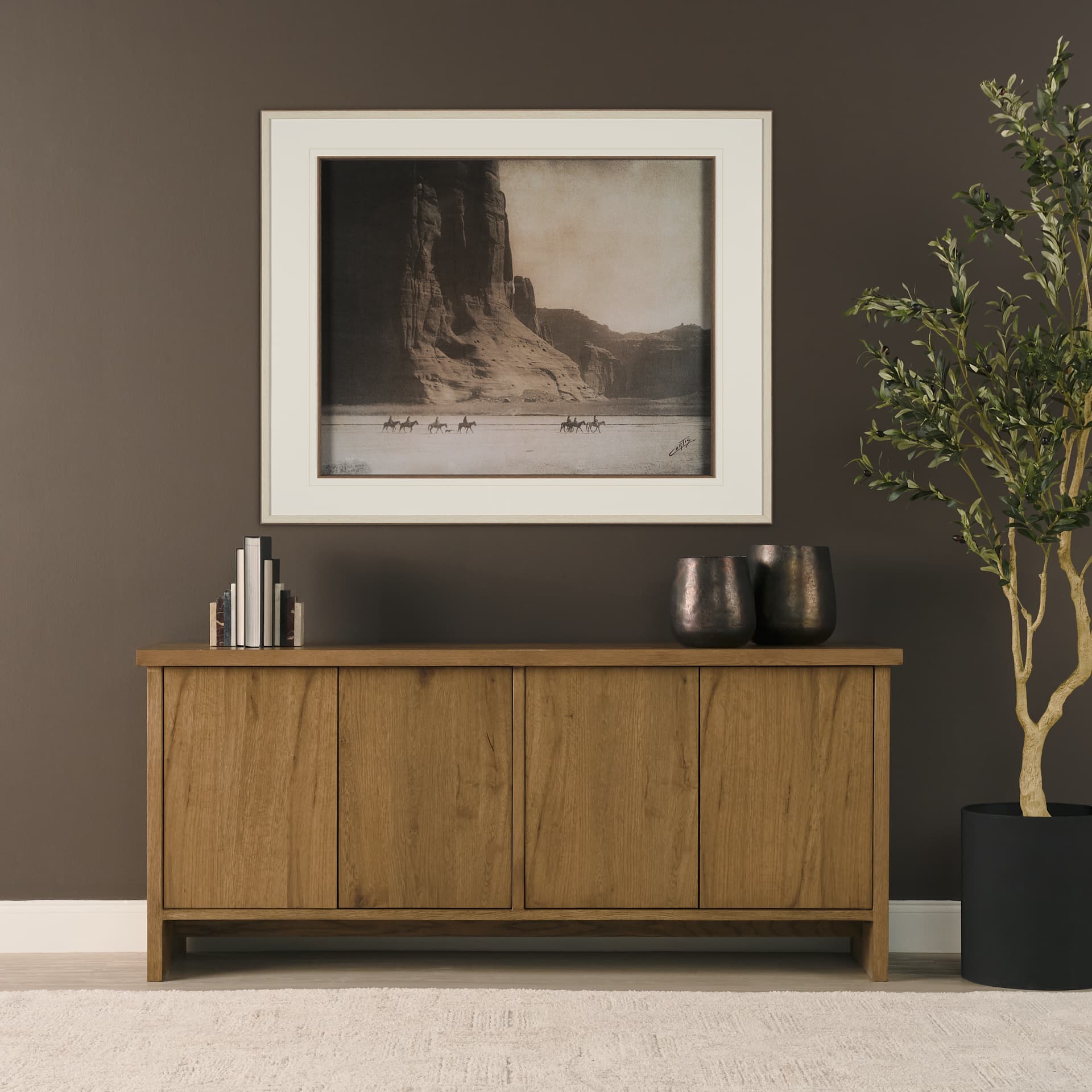 Alcott Brown Wood 4 Door Closed Sideboard — in a styled room