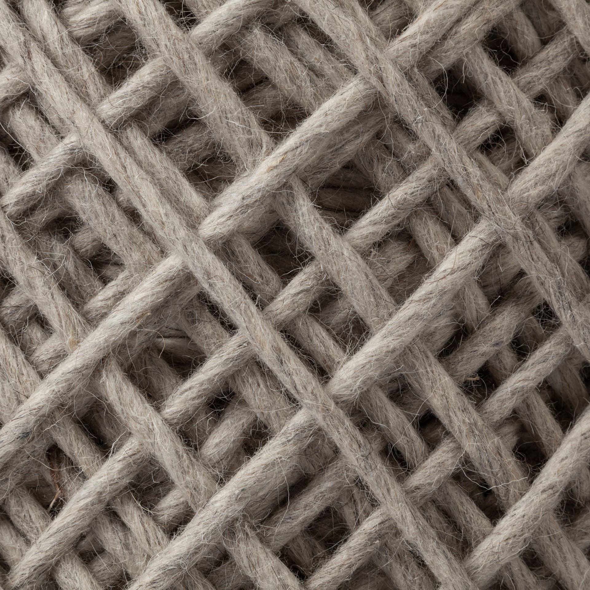 Allium Oatmeal Handwoven Wool Cylindrical Pouf — product photograph