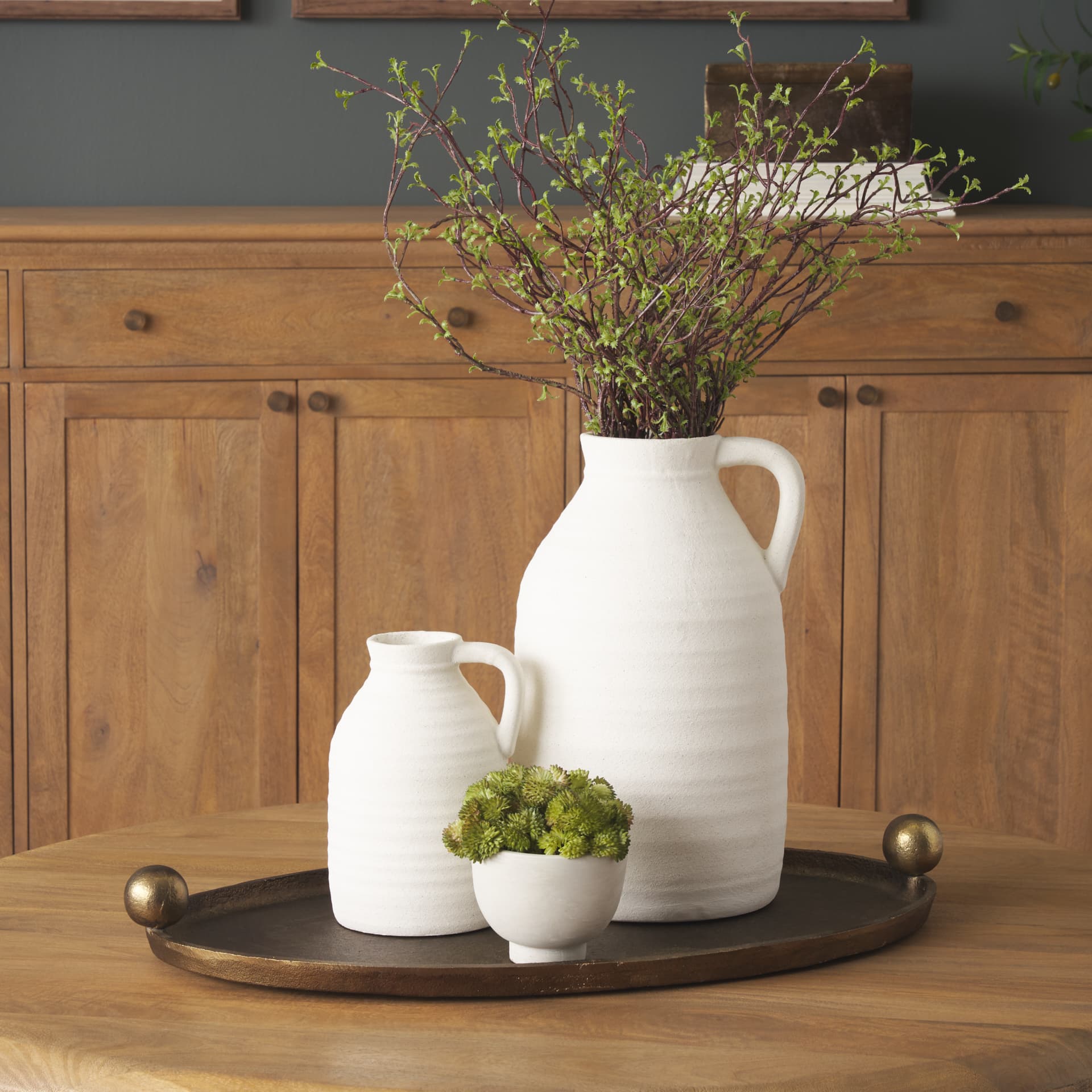Jianna Large Oval Textured Antiqued Gold Metal Tray with Handles — in a styled room