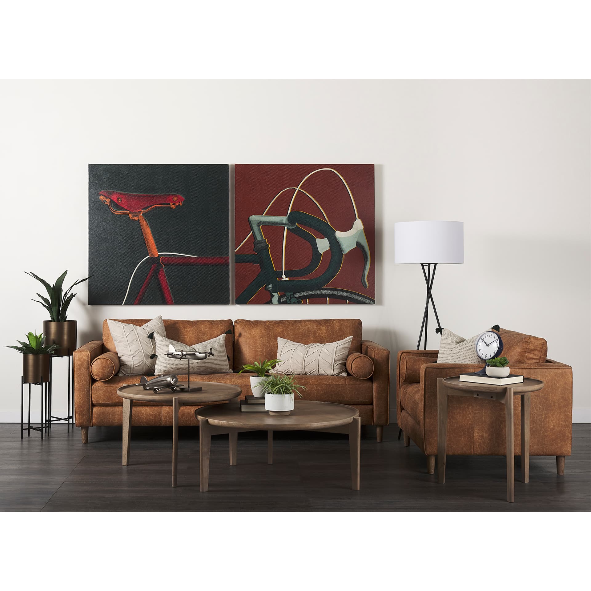 Loretta 88.0L x 36.2W x 33.9H Cognac Brown Faux Leather Three Seater Sofa with Two Bolster Cushions — in a styled room