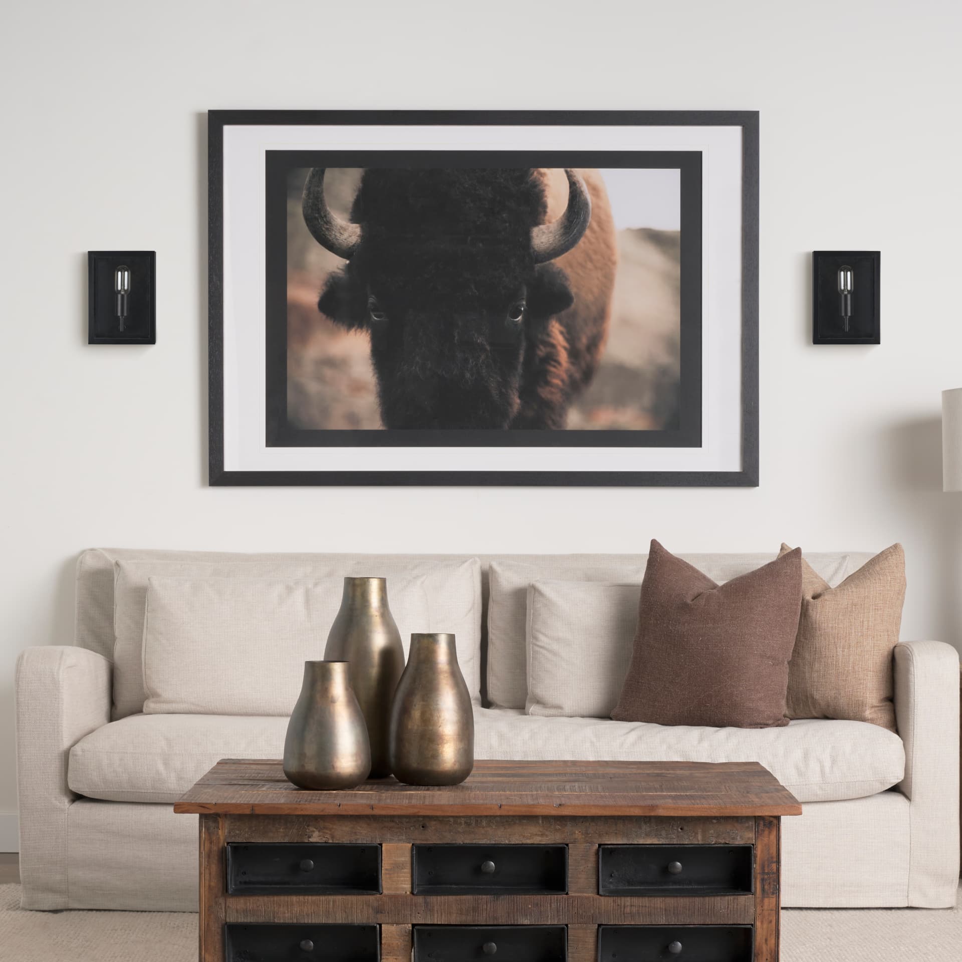 Cairn Matte Black Metal w/ Glass 1-Light Wall Sconce — in a styled room