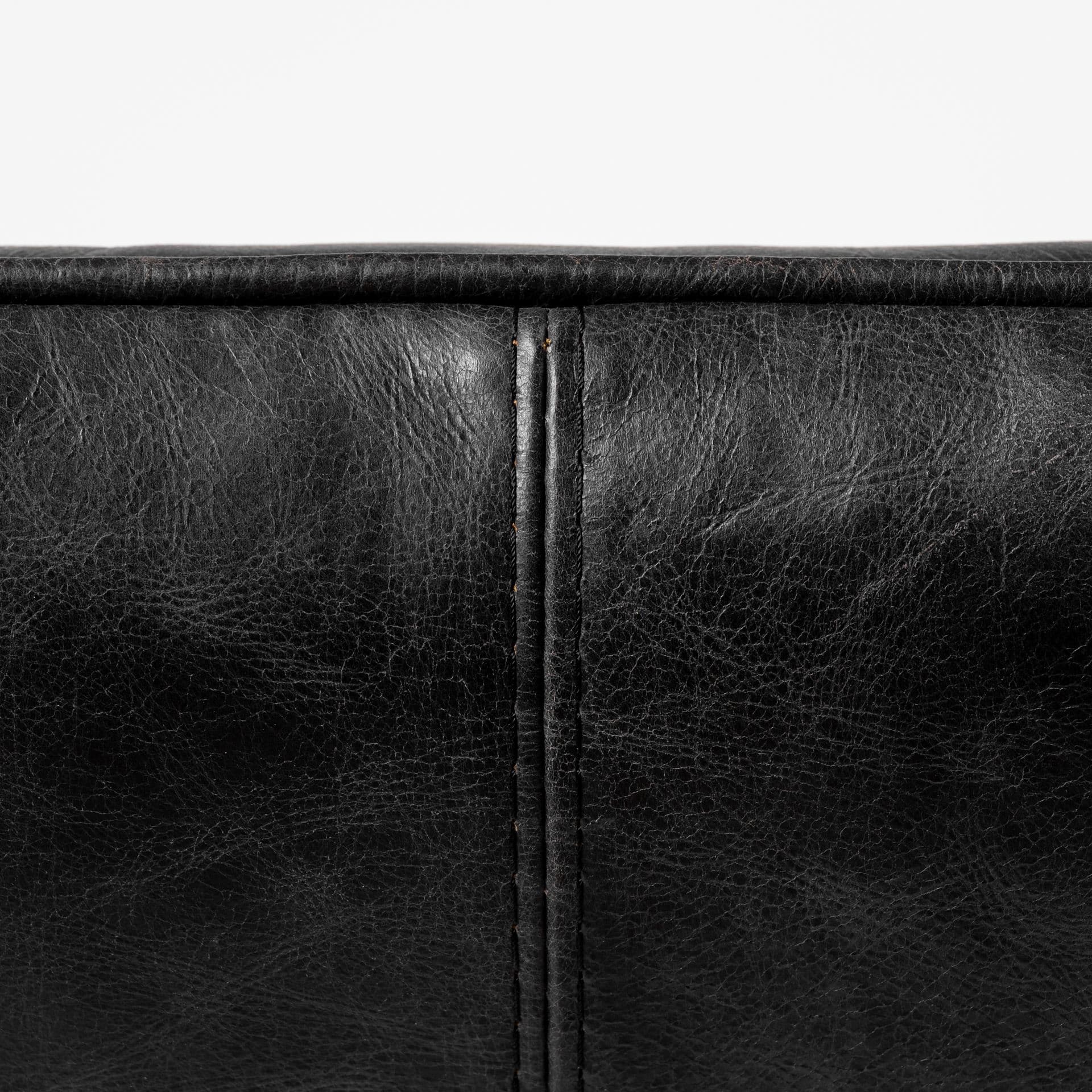 Flavelle II Black Leather Cushion Seat and Solid Iron Base Accent Chair — product photograph