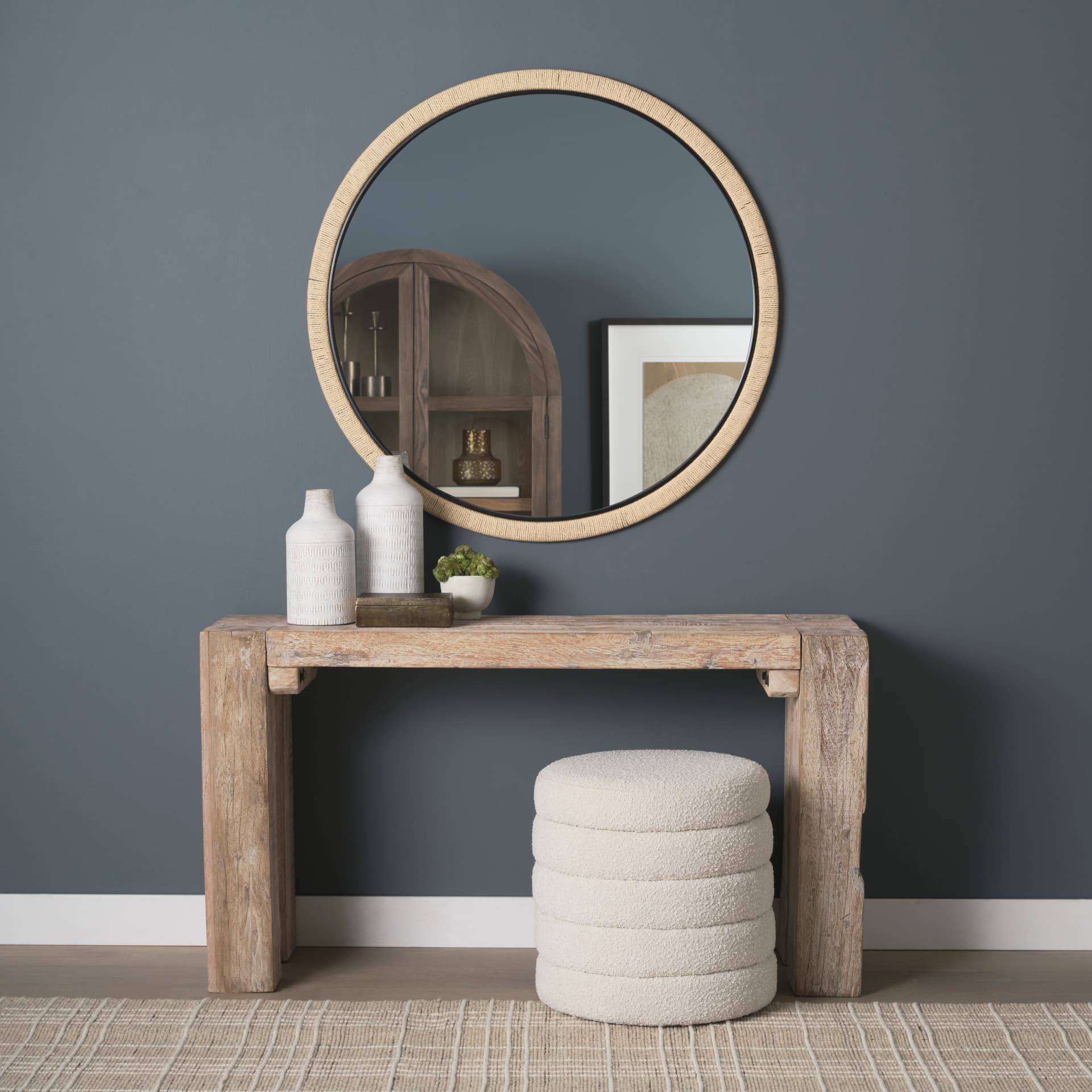 Vasie Black Wood w/ Jute Round Mirror — in a styled room