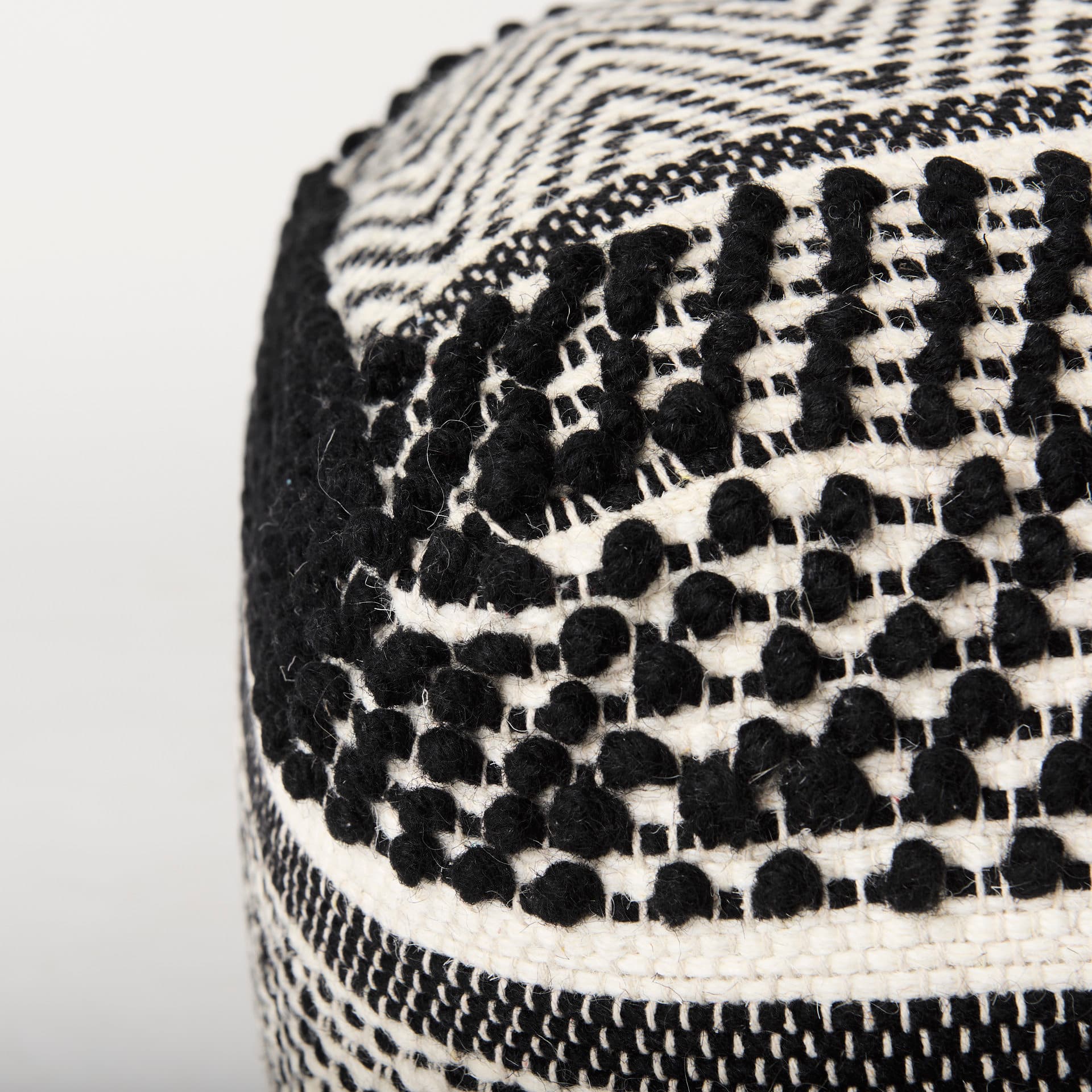 Garima 22.0L x 22.0W x 14.0H Black/White Wool and Cotton Patterned Pouf — product photograph