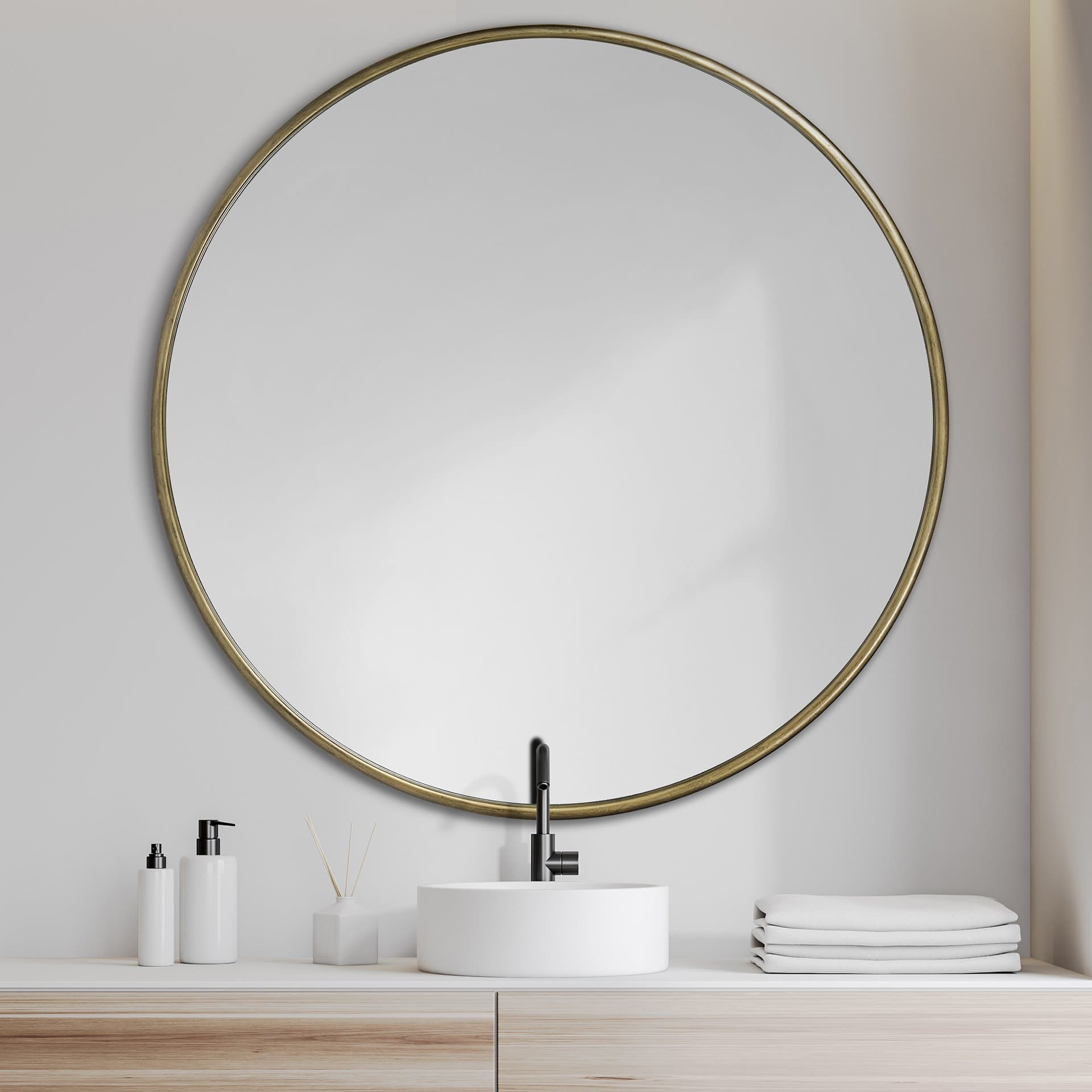 Piper 47.2L x 1.0W x 47.2H Large Gold Metal Round Wall Mirror — in a styled room