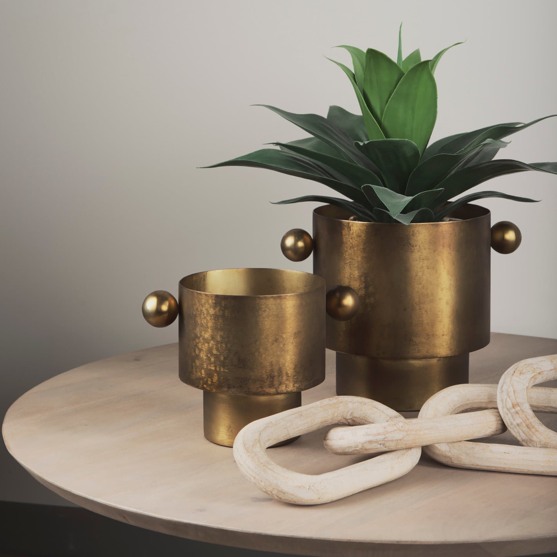 Juno 8.5H Large Gold Iron Vase — in a styled room