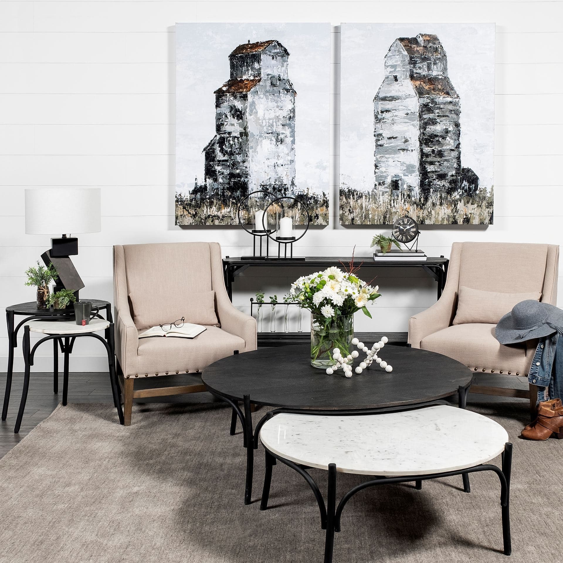 Etienne VII 24" Set of Two Round Top Black Wood and Marble Top Nesting Table — in a styled room