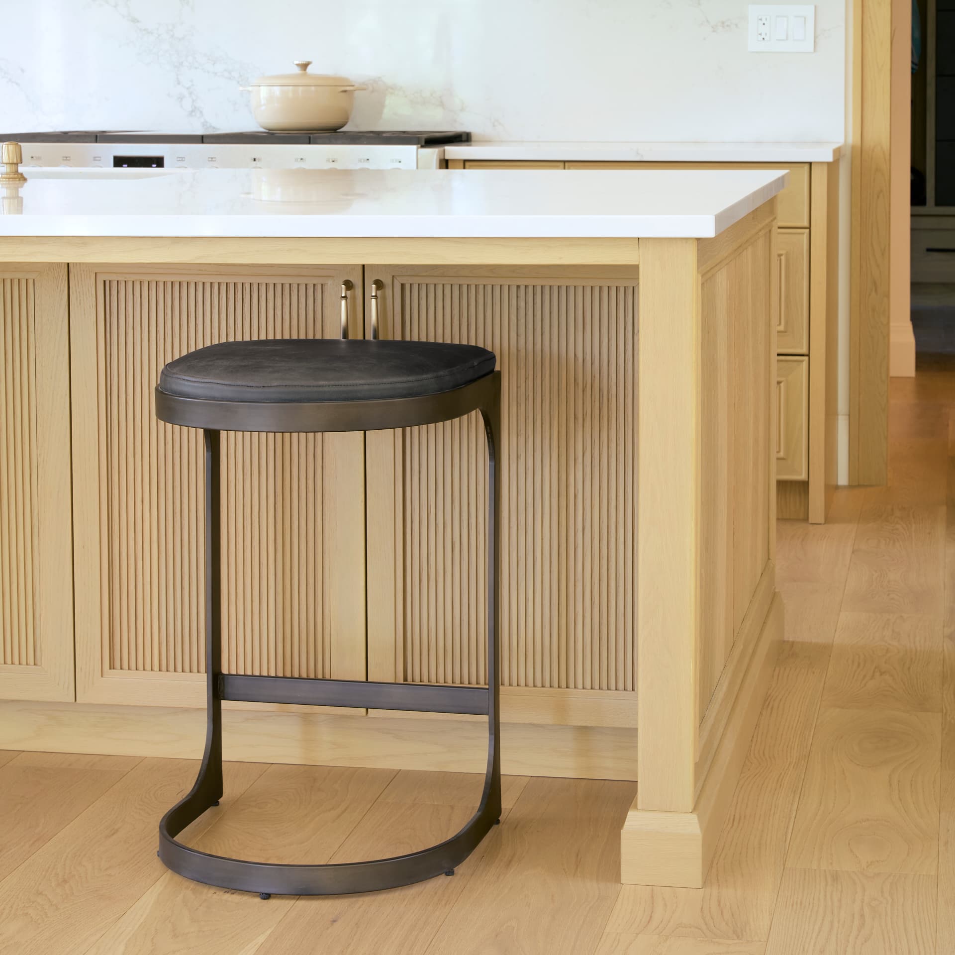 Tyson Backless 28in Seat Bar Stool | Black Leather w/ Black Metal — in a styled room
