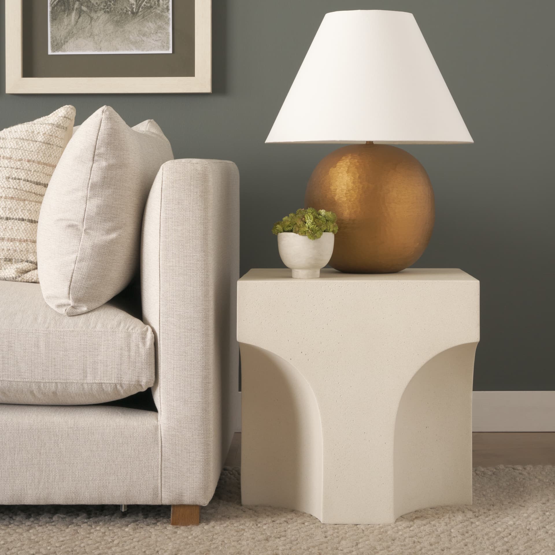 Bunda Square Sculptural Stone Finish Accent Table — in a styled room