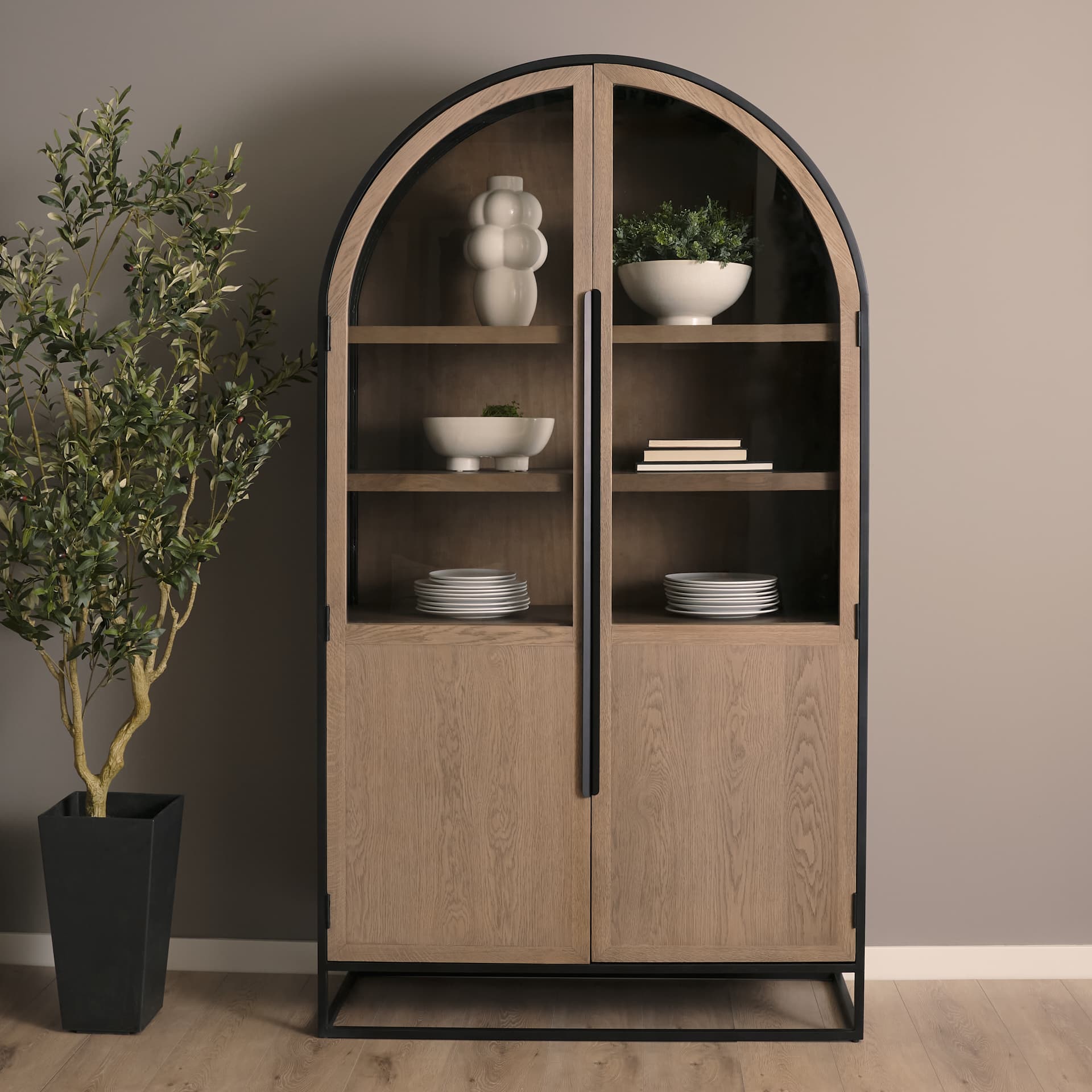 Sloan 47.5W x 80.5H Light Brown W/Black Metal Frame Arched Cabinet — in a styled room
