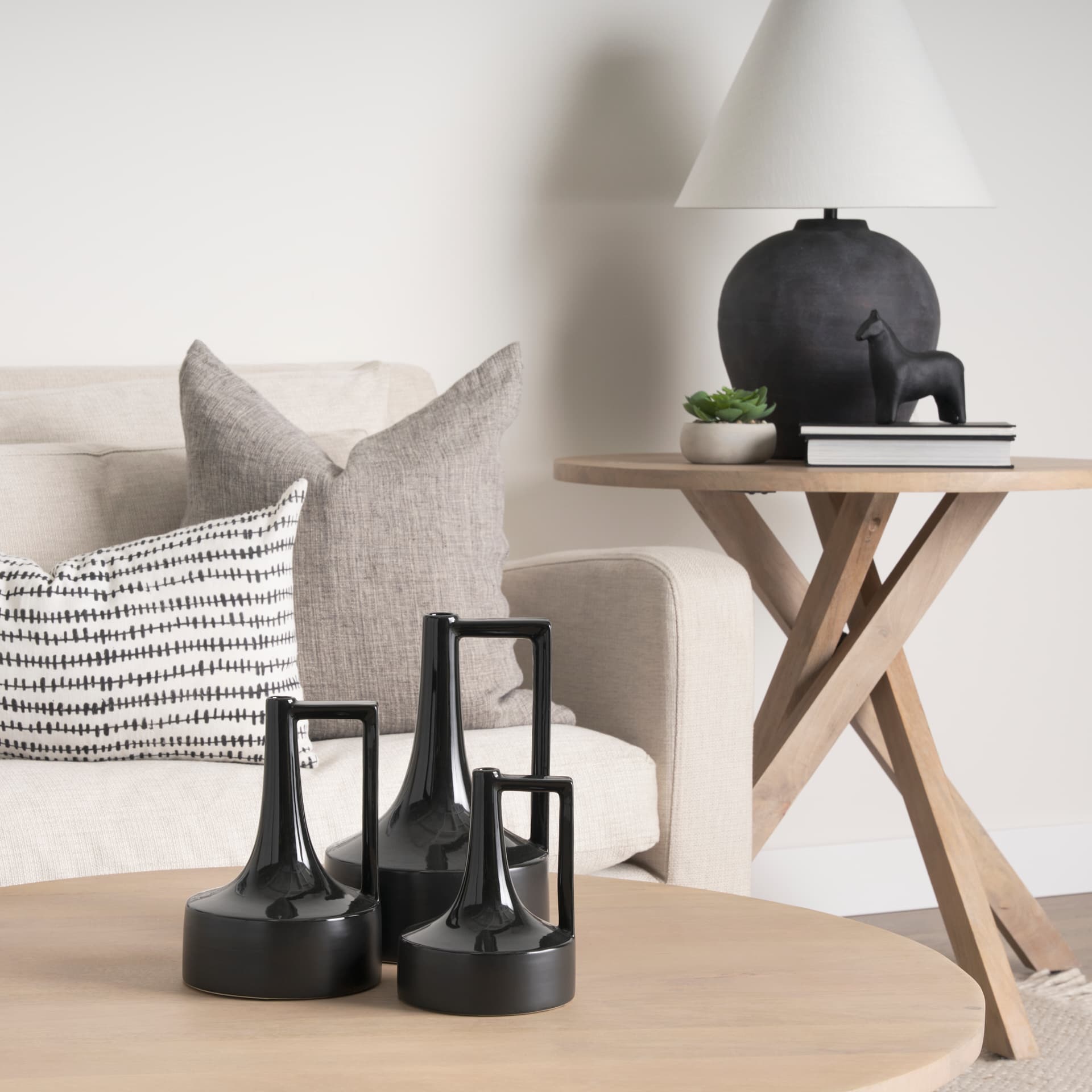 Burton 13.1H Large Glossy and Matte Black Ceramic Jug Vase — in a styled room