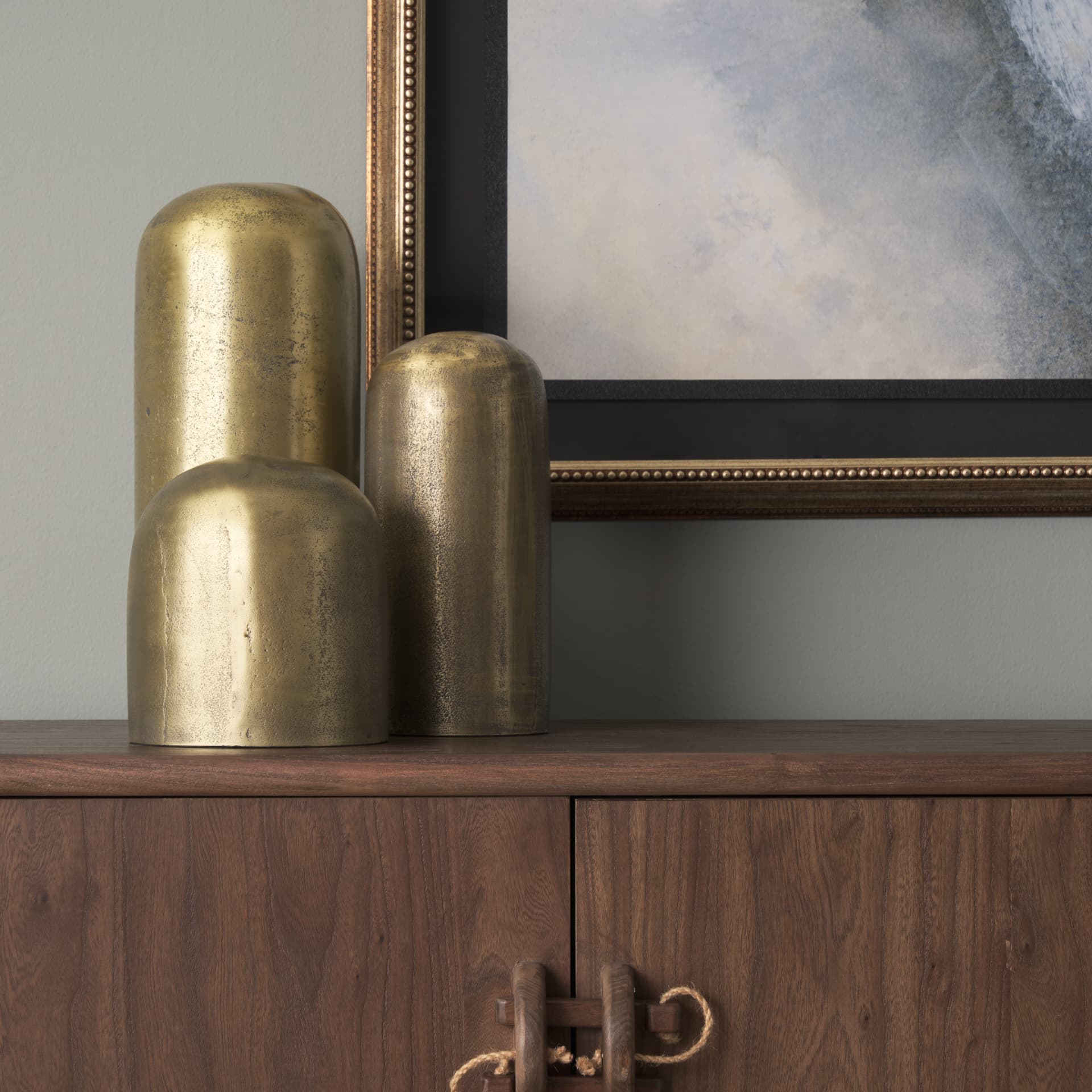 Quonset Short Brass Finished Aluminum Metal Ornament — in a styled room