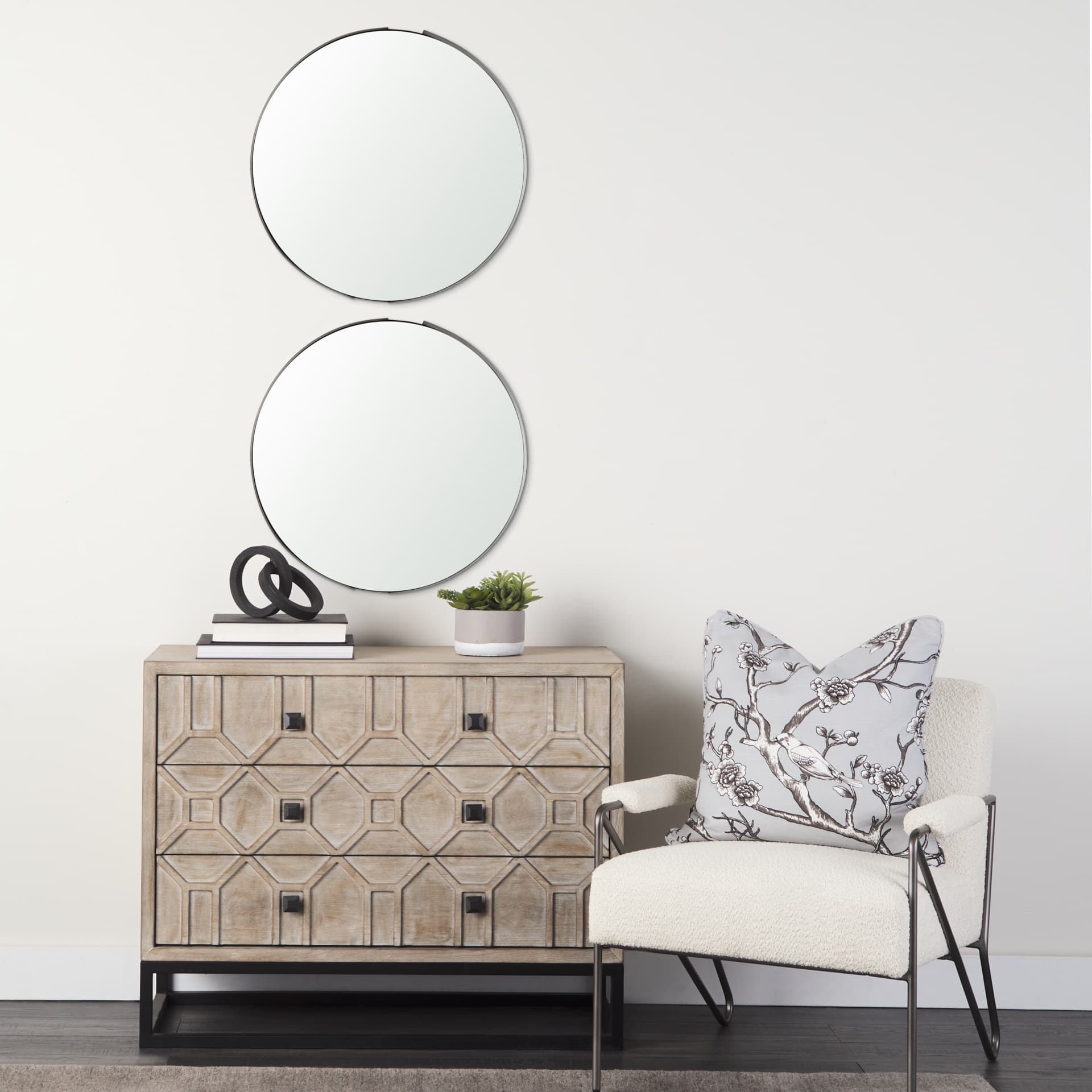Adrianna 24.4" Black Metal Round Mirror — in a styled room