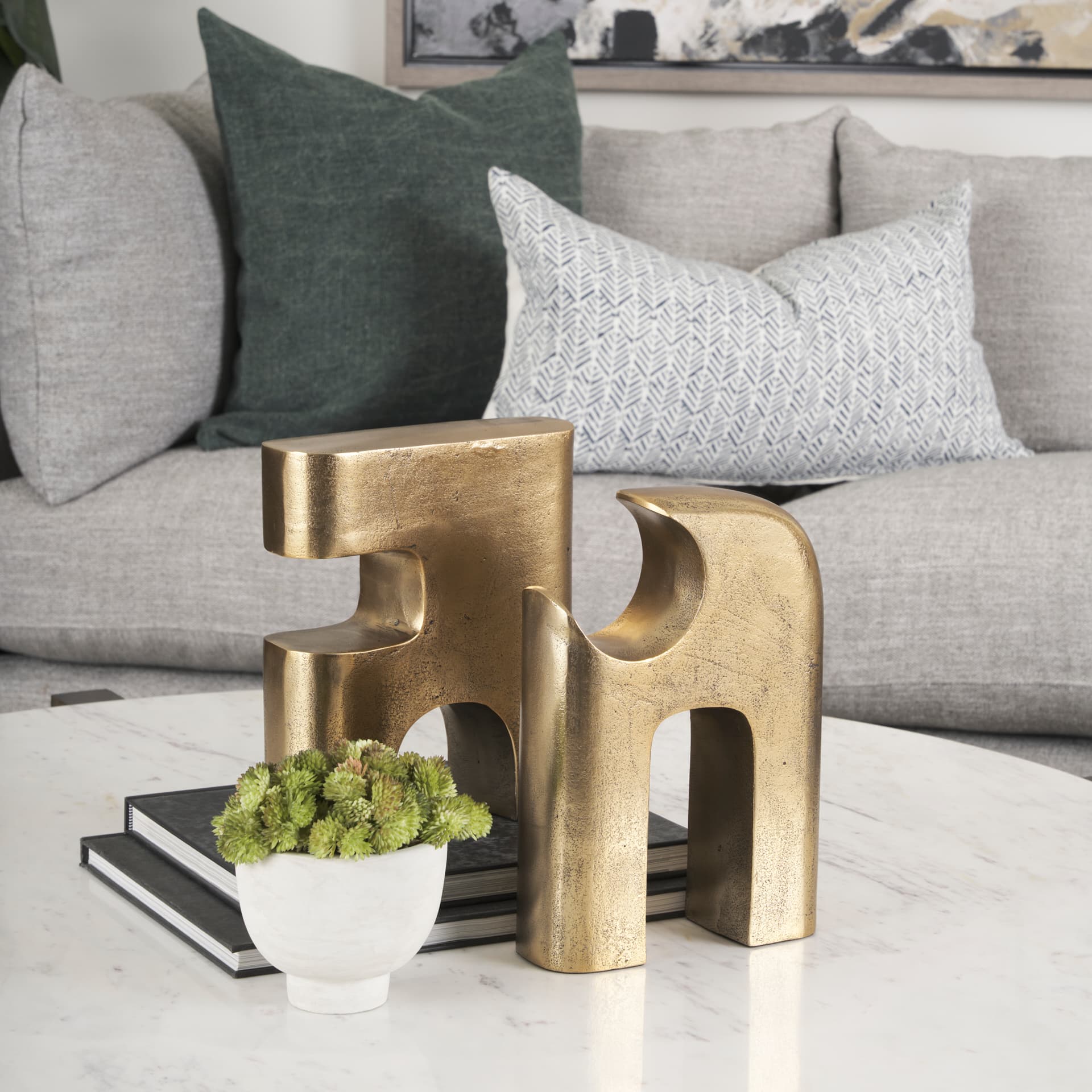 Renni Antiqued Brass Small Decorative Sculpture — in a styled room
