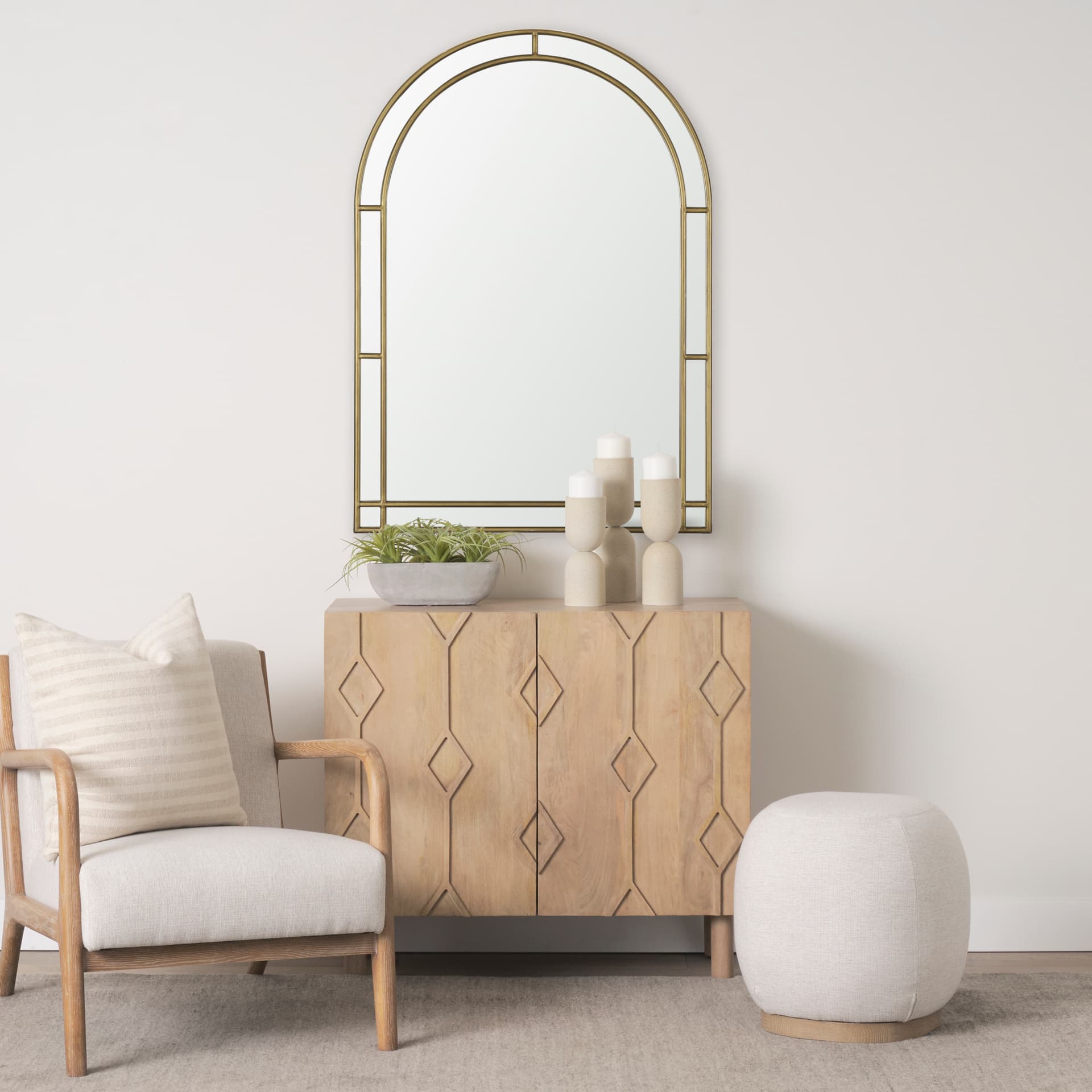 Tiffany Brushed Gold Double Frame Metal Arched Mirror — in a styled room