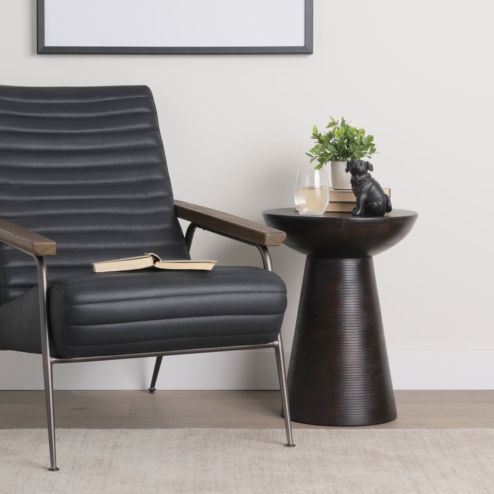 Novell Dark Brown Wood Pedestal Accent Table — in a styled room