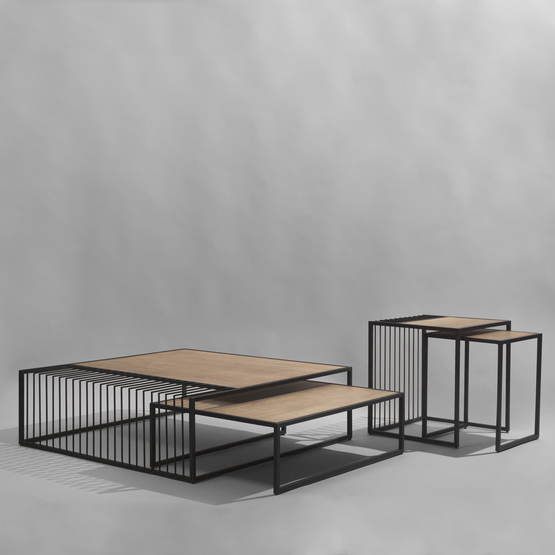 Miles Black Metal w/ Light Wood Nesting Coffee Table — in a styled room