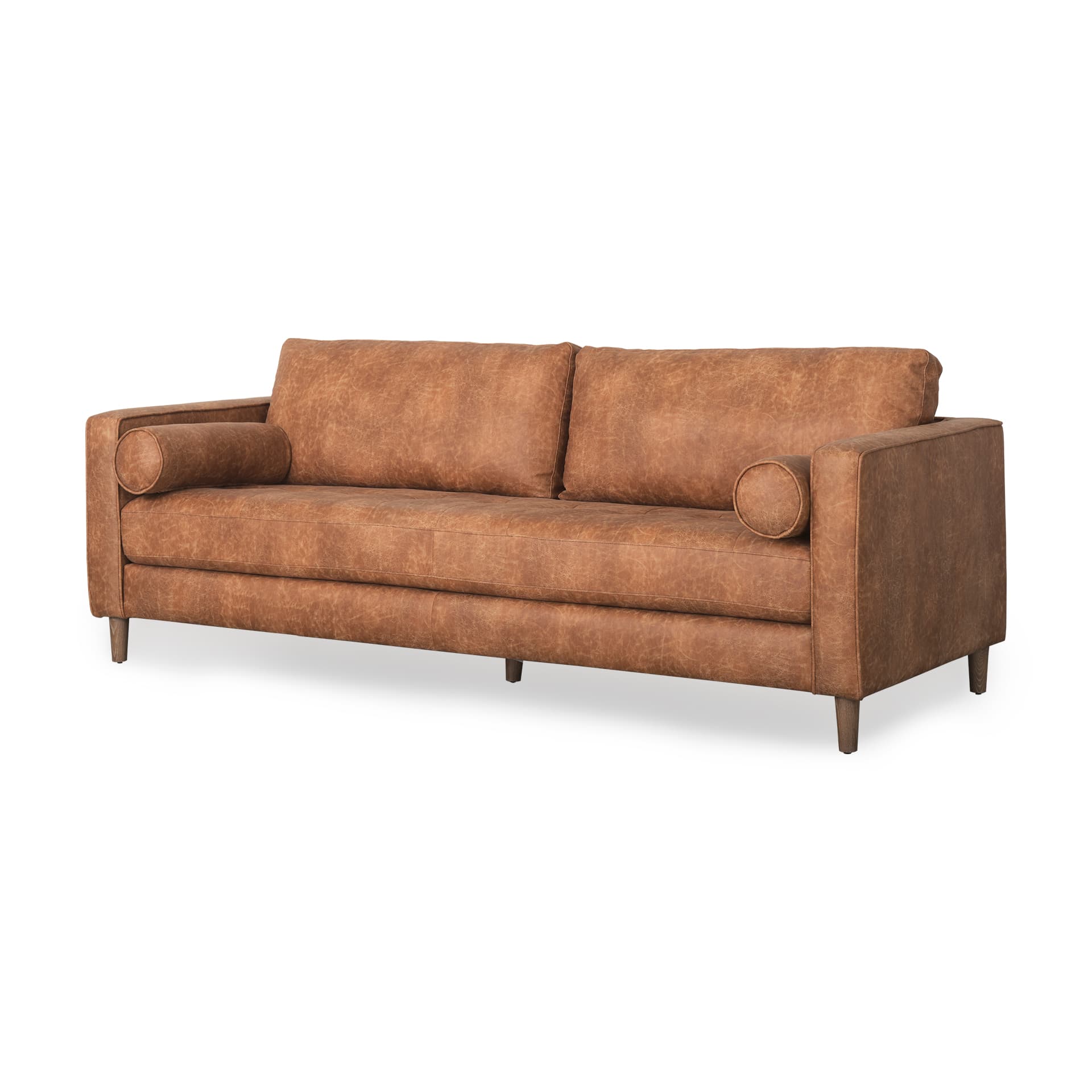 Loretta 88.0L x 36.2W x 33.9H Cognac Brown Faux Leather Three Seater Sofa with Two Bolster Cushions — product photograph
