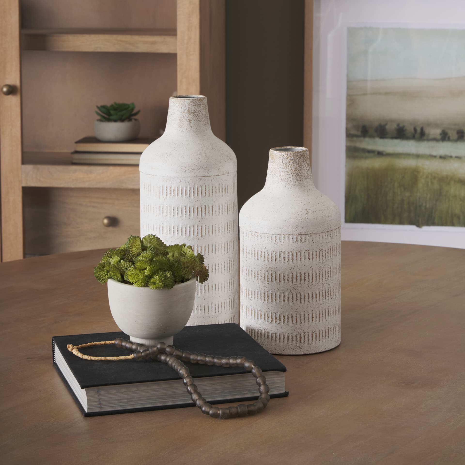 Tisha Large White W/ Terracotta Distressing Metal Vase — in a styled room