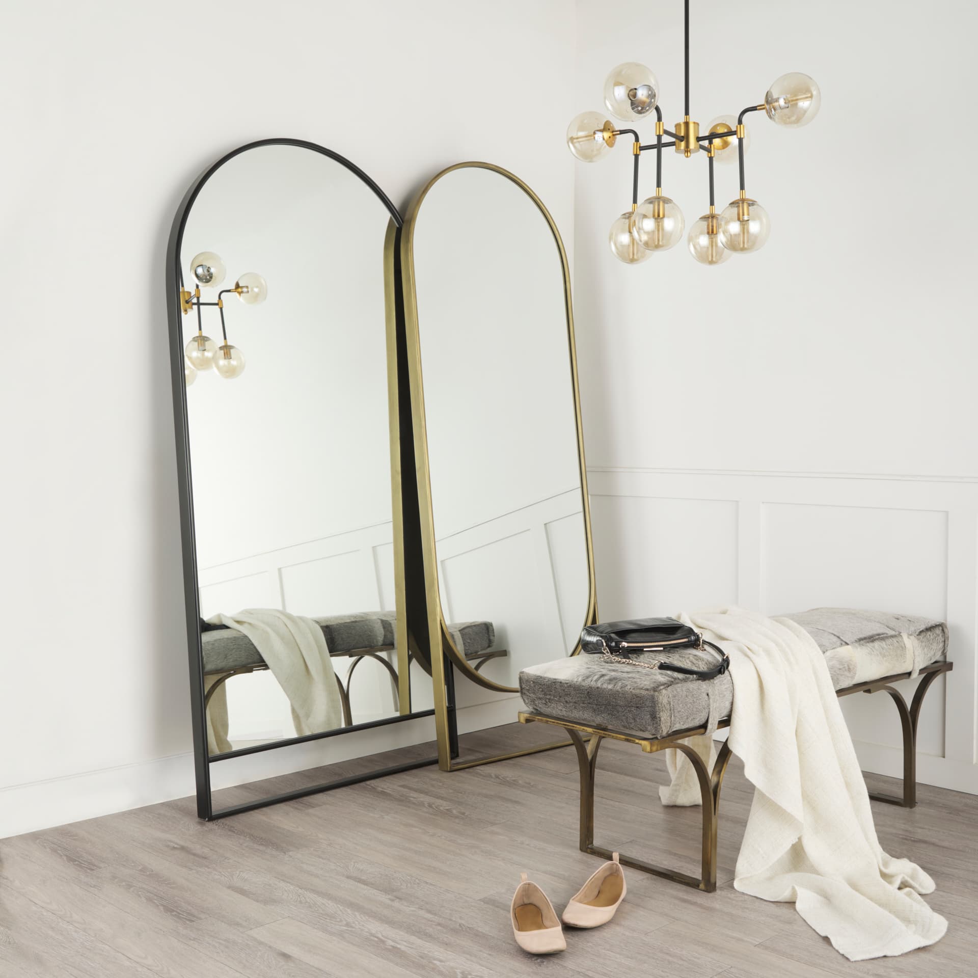Sadie 28.0L x 2.0W x 78.0H Antique Gold Rounded Arch Floor Mirror — in a styled room