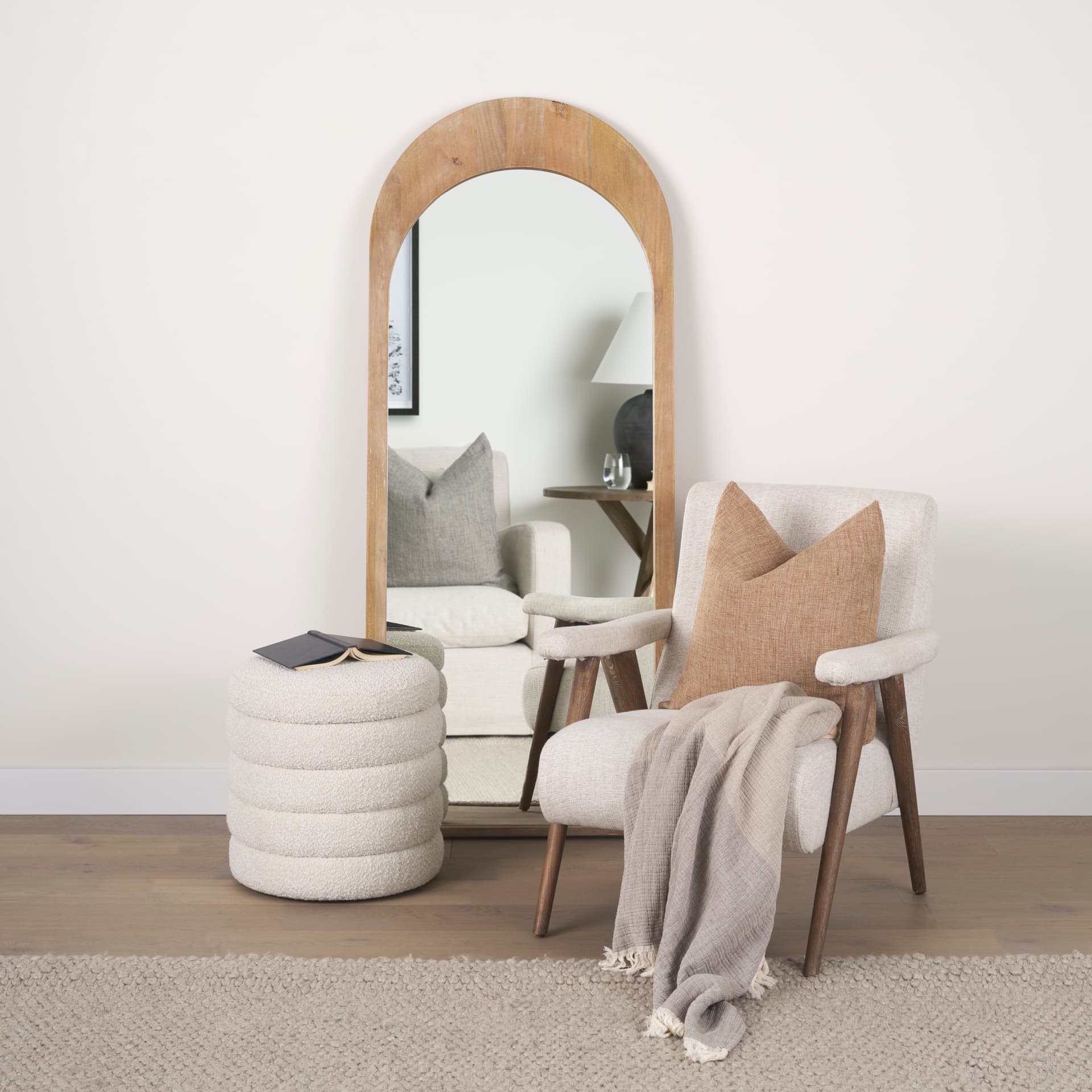 Celeste Light Brown Wood Arched Floor Mirror — in a styled room