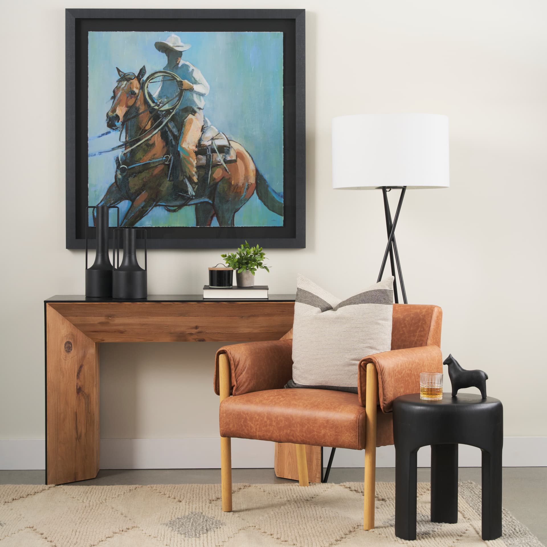 Tabor Natural Wood w/ Black Oak Waterfall Console Table — in a styled room