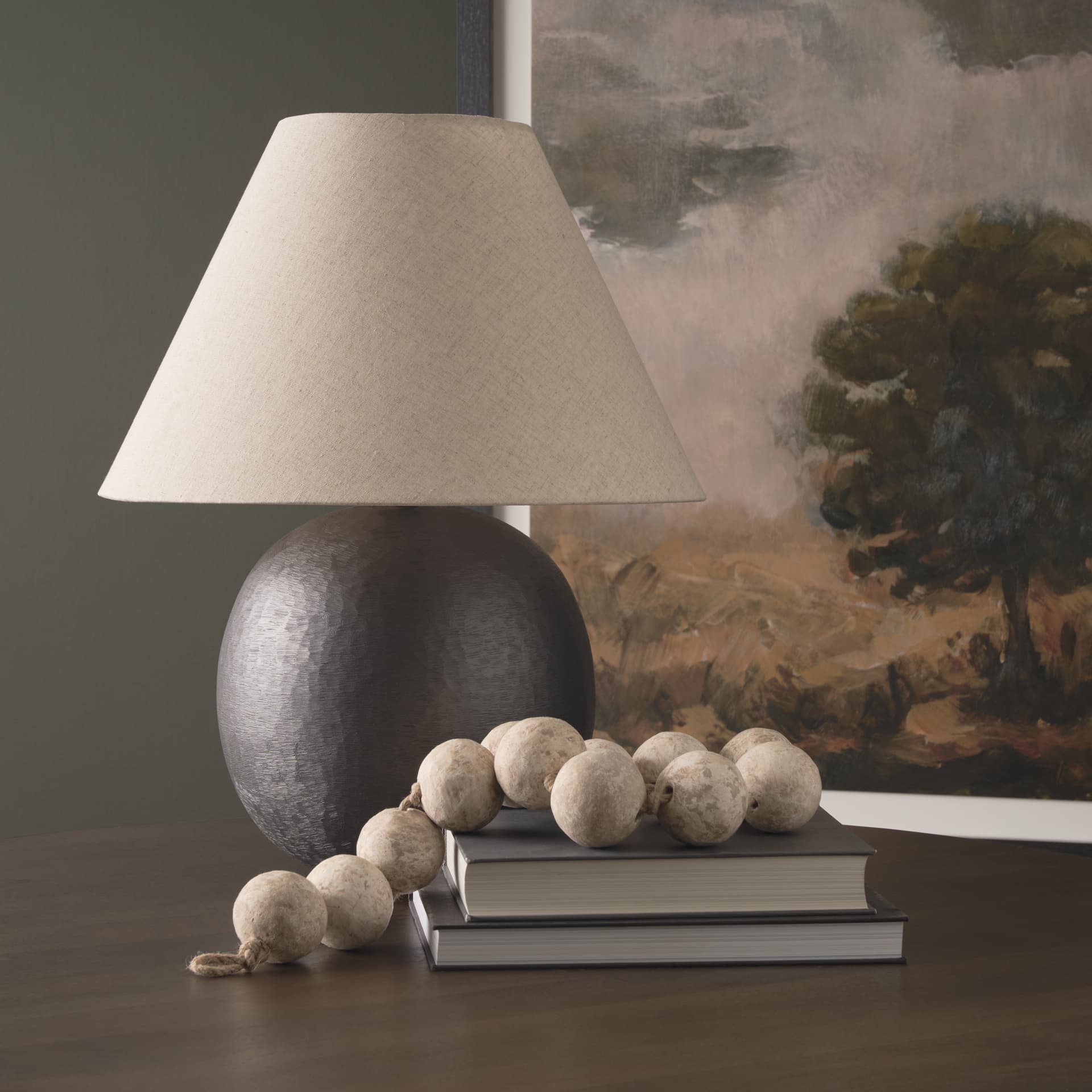 Sadiyah Black Brushed Metal w/ Beige Shade Table Lamp — in a styled room