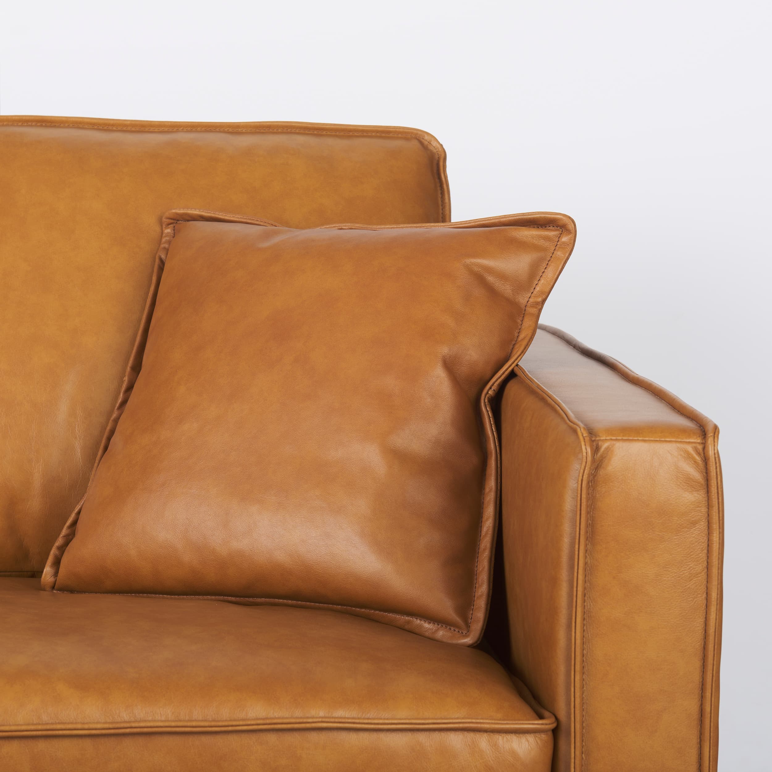 D'Arcy 111"L x 70"D x 33"H Tan Leather Left Chaise Sectional — product photograph