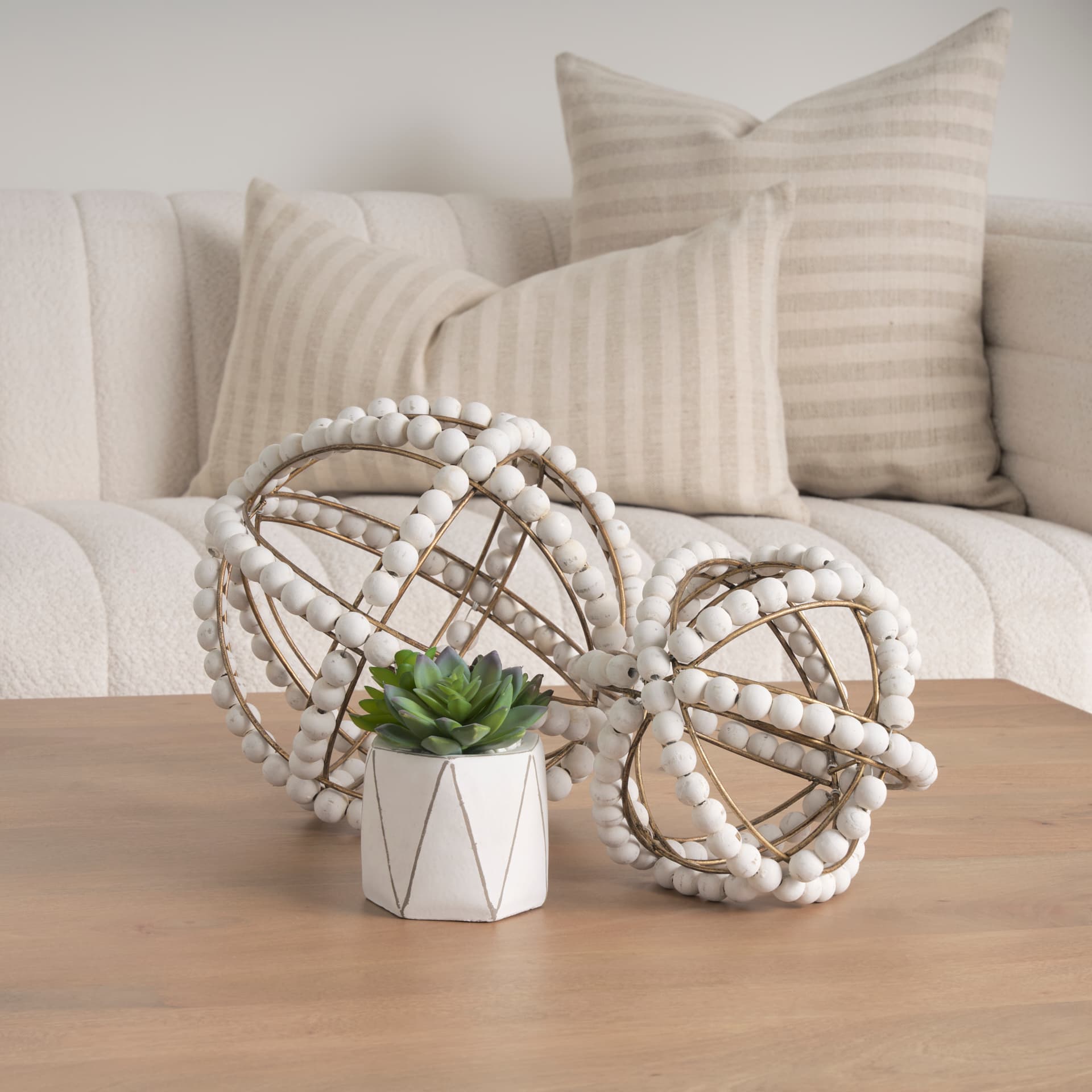 Espanlade I Small 9L x 9W White Wooden Beaded Orb — in a styled room