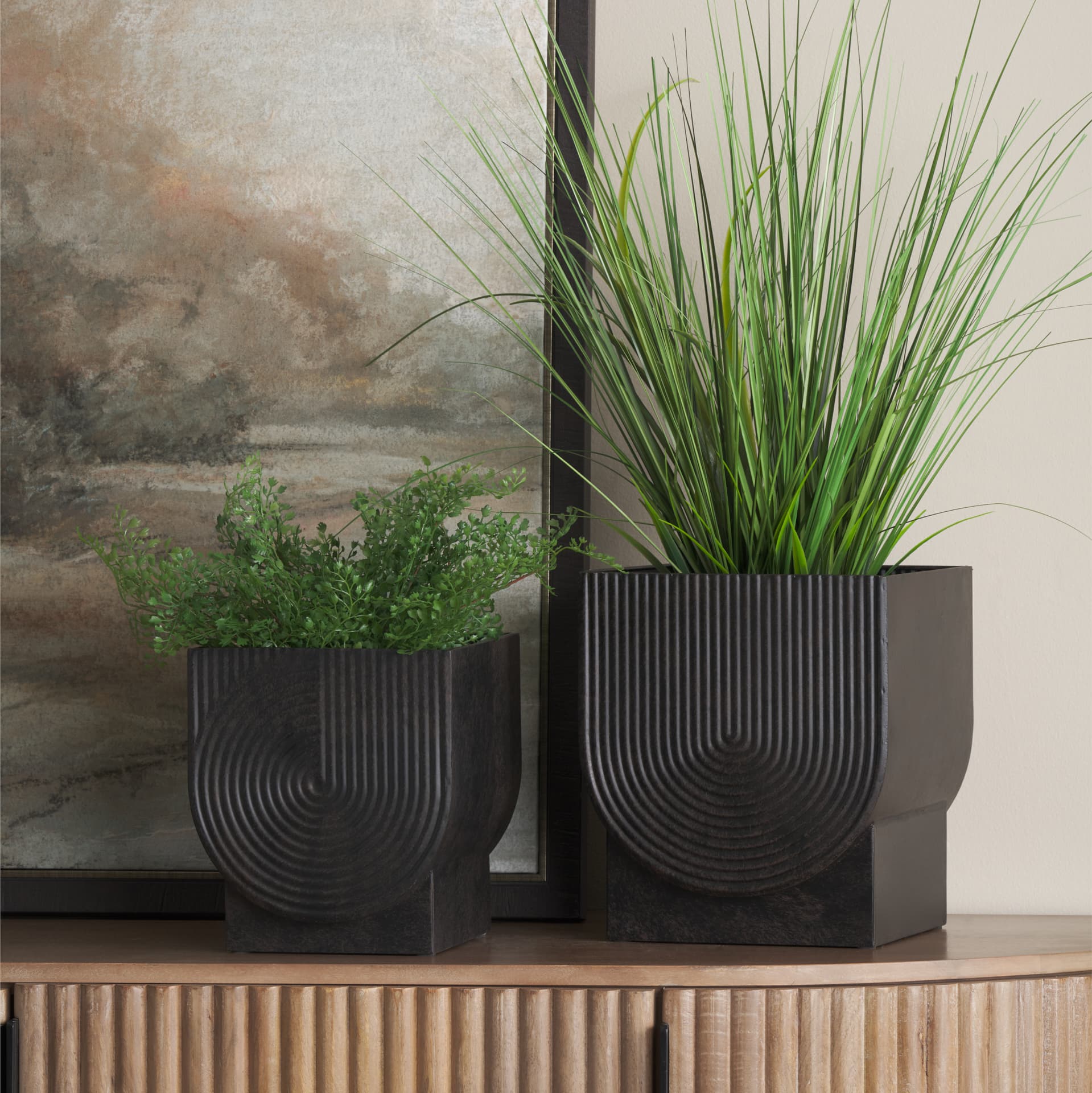 Medina Antiqued Black Metal Planters (Set of 2) — in a styled room