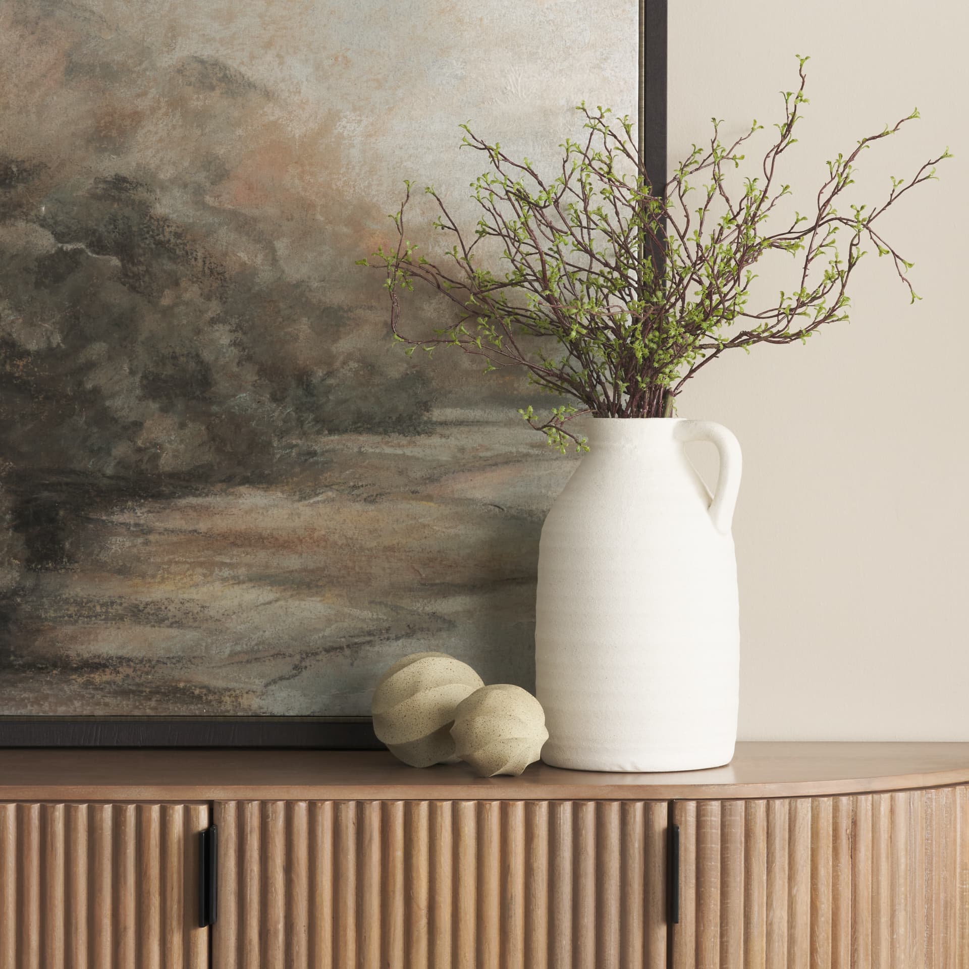 Imani Small Sculptural Textured Beige Metal Decorative Orb Object — in a styled room