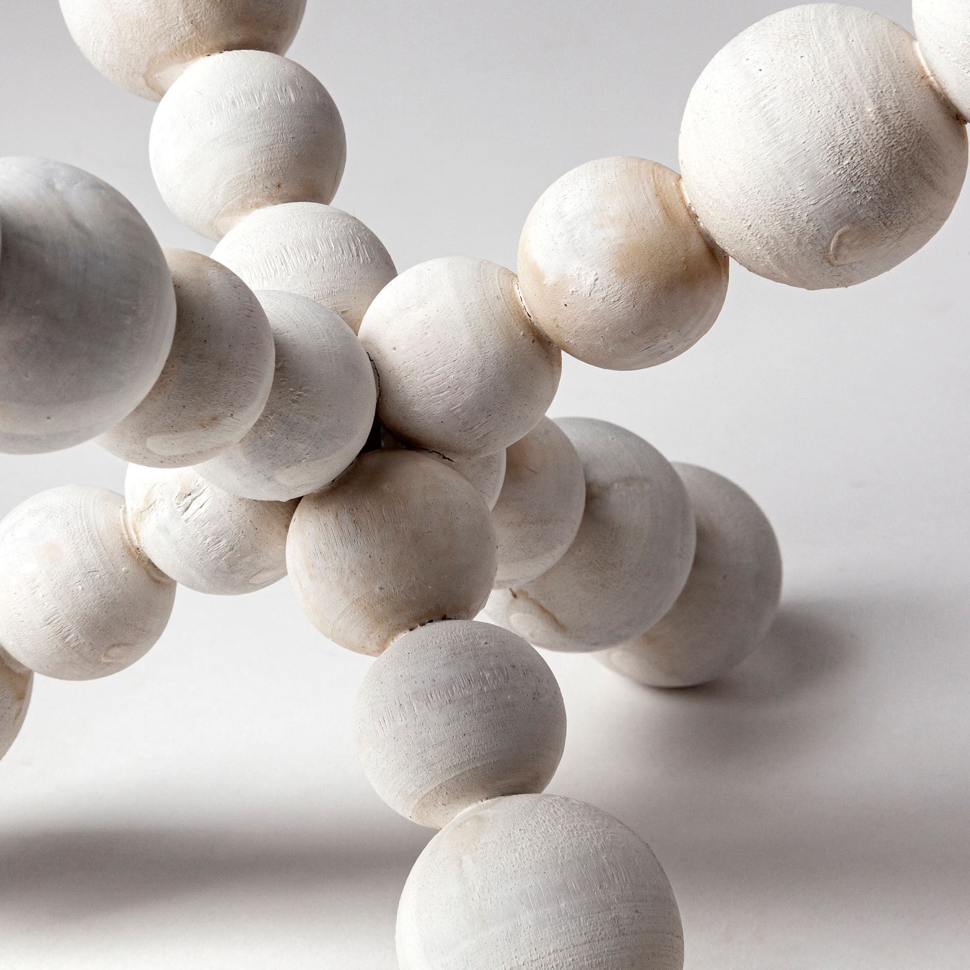 Carrollton II (Large) 9L x 9W Off-White Geometric Wood Ball Jack — product photograph