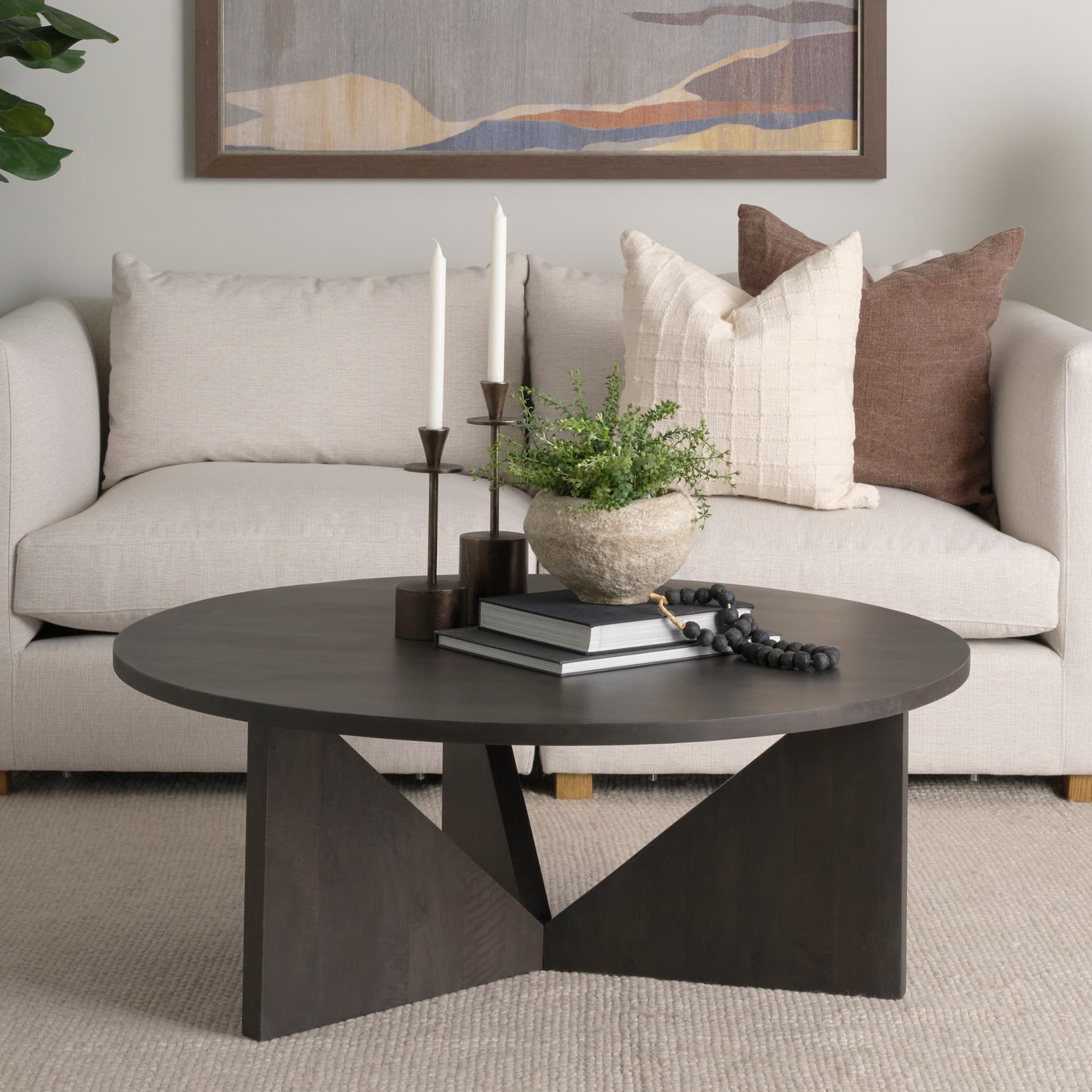 Tarro Brown Wood w/ Triangle Legs Coffee Table — in a styled room