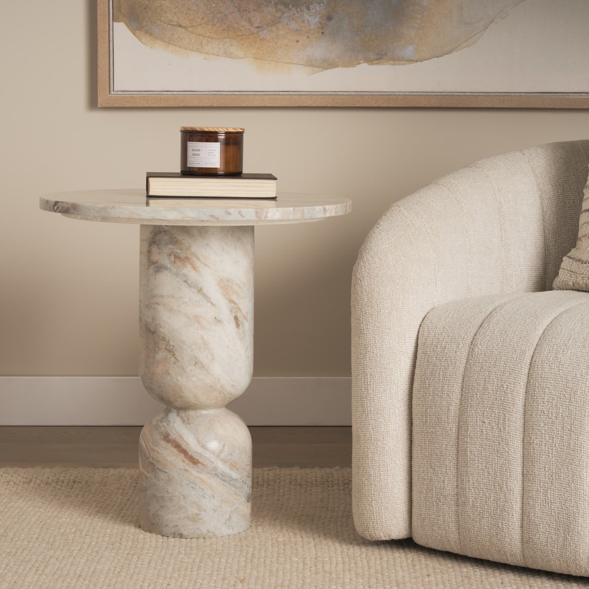 Nylah Solid Pink Marble Round Accent Table — in a styled room