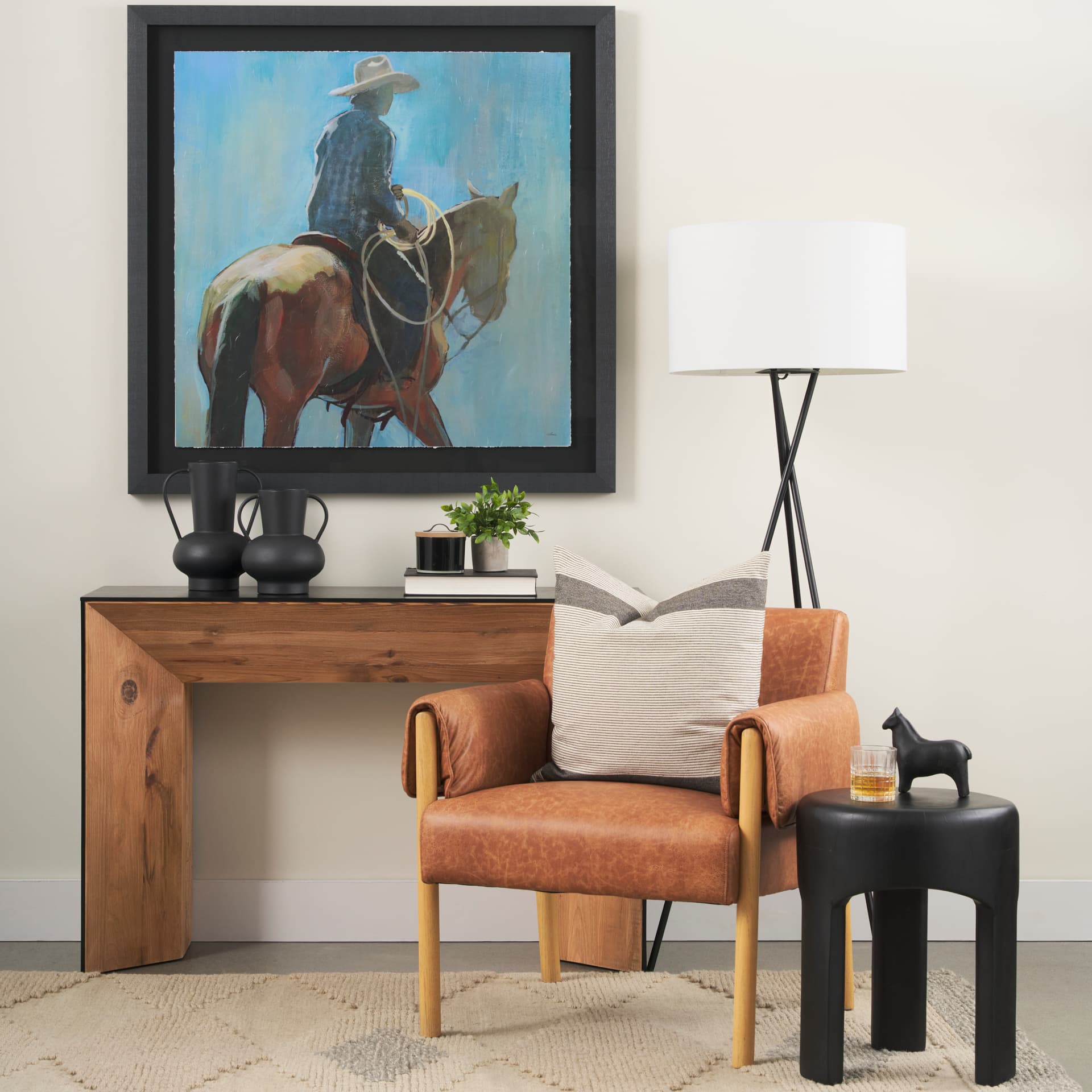 Tasya Small Matte Black Metal Vase — in a styled room