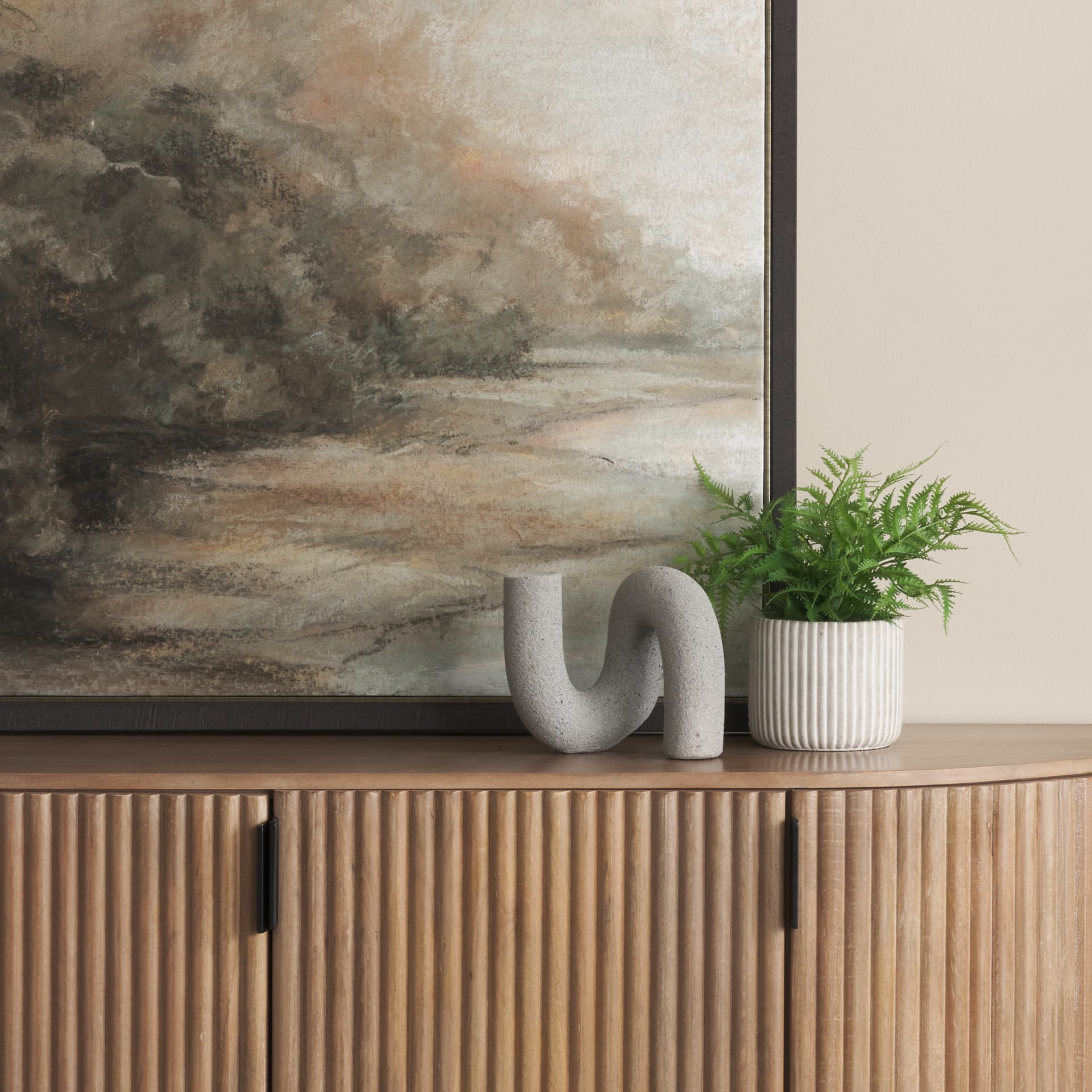 Kailas Resin Textured Concrete Gray Decorative Object — in a styled room