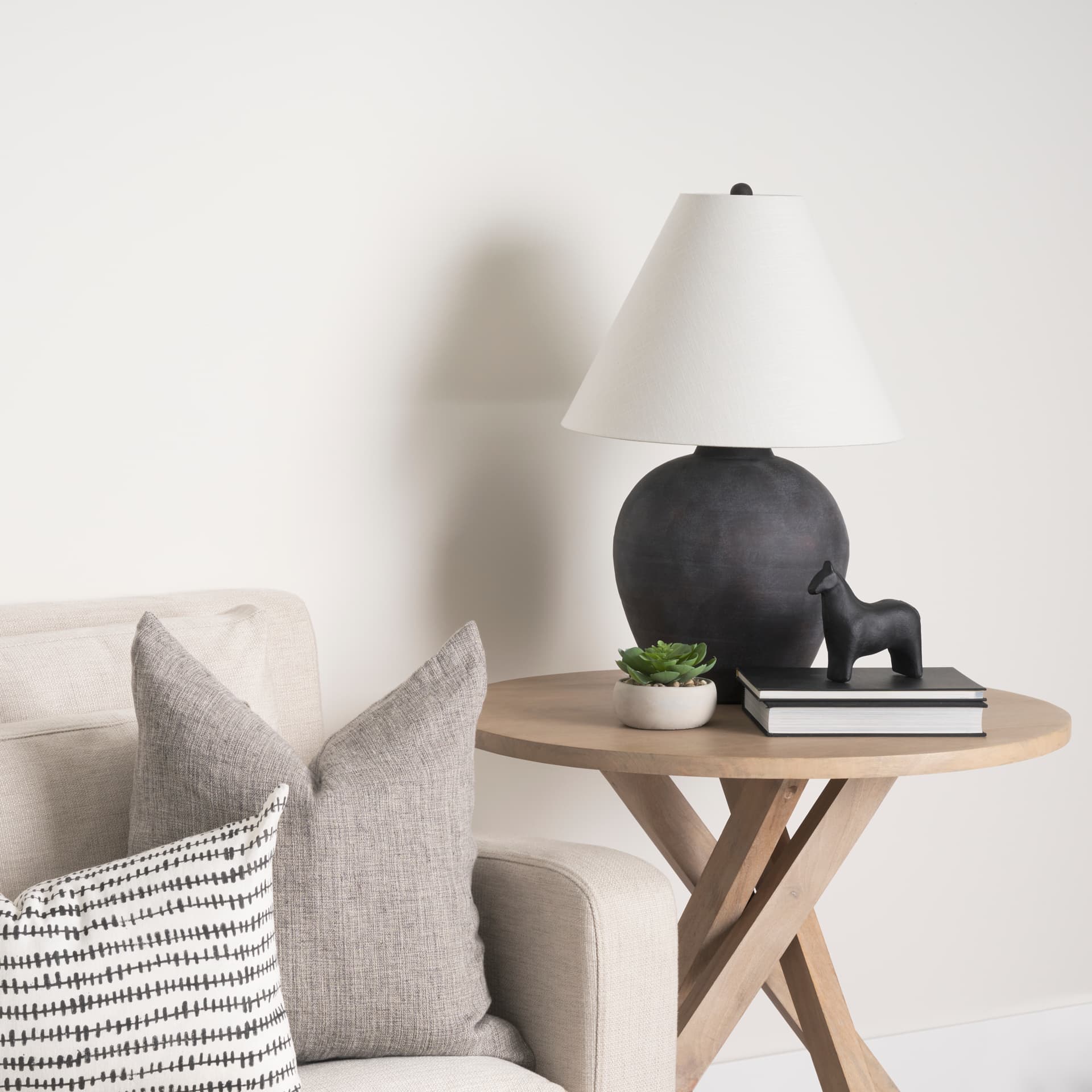 Sphynx II 7L x 2W Black Cast Aluminum Horse Shaped Object — in a styled room