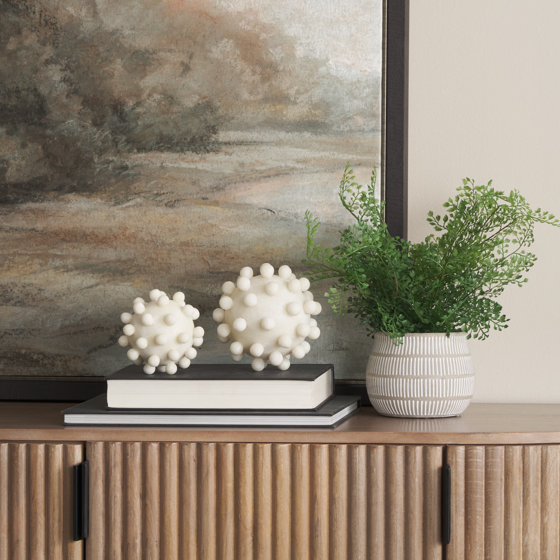Malo 5.9L x 5.9W x 5.9H Cream Resin Large Sphere Decorative Object — in a styled room