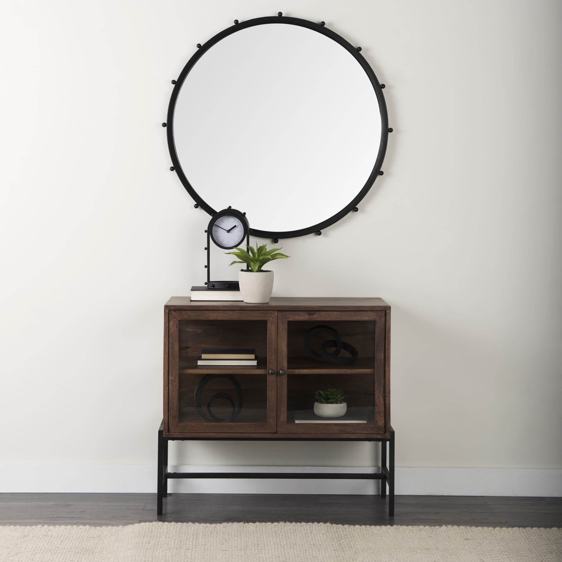 Arelius 36L x 18W x 32H Medium Brown Wood, Black Metal Base w/ 2 Glass Doors Accent Cabinet — in a styled room