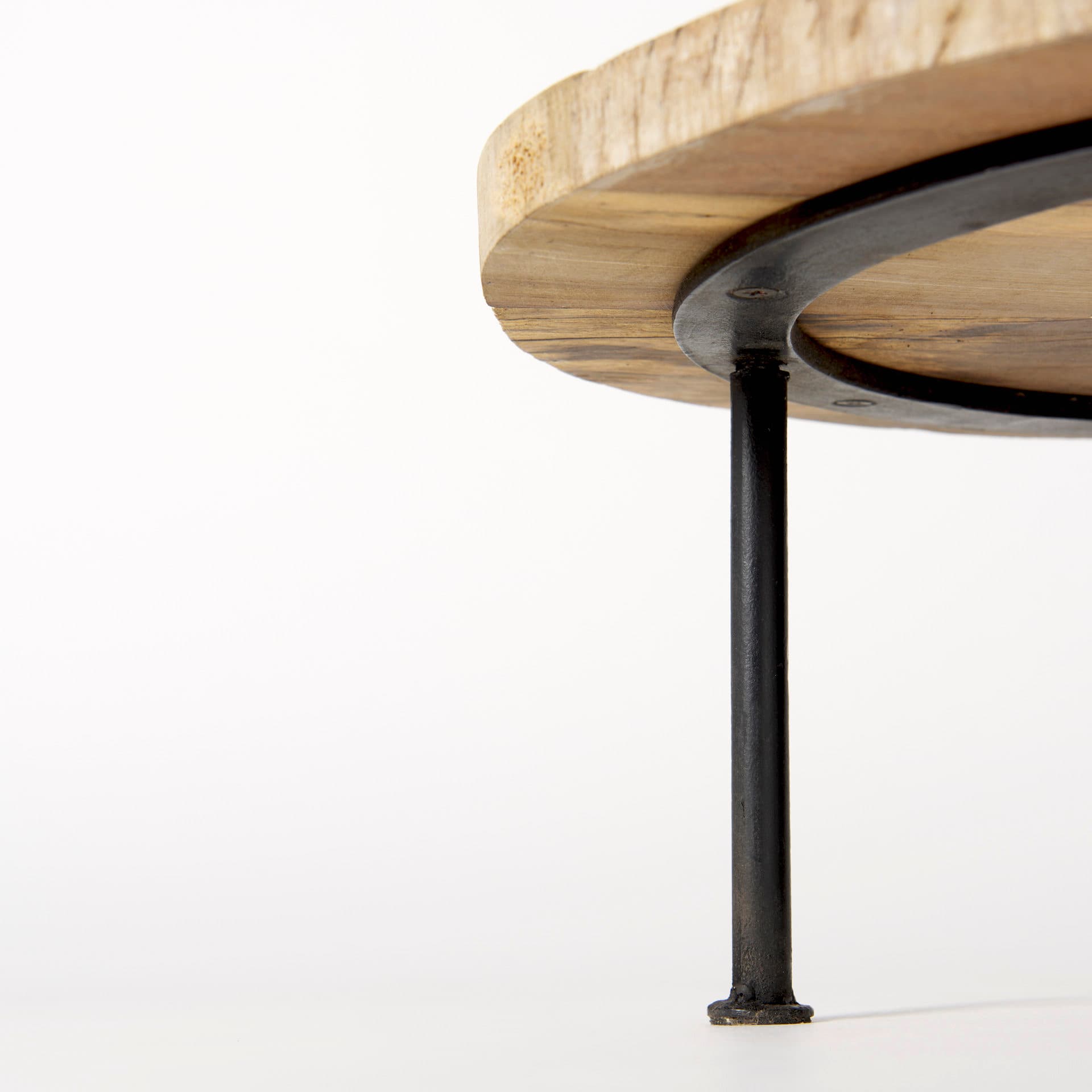 Cedric 15L x 15W x 4.5H Round Light Brown Wood w/ Black Metal Legs Decorative Display Stand — product photograph