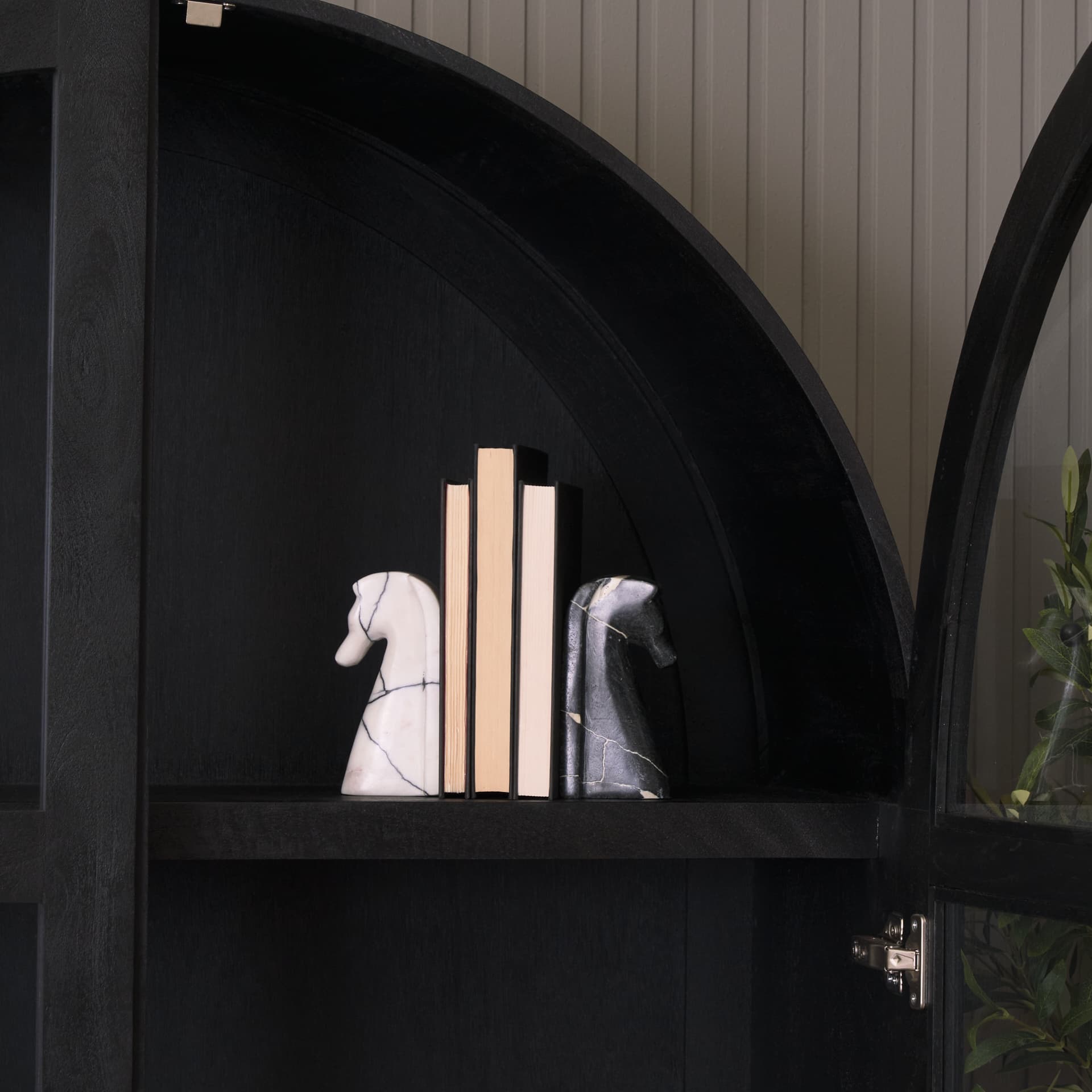 Cavalli Black and White Marble Horse Bookends — in a styled room