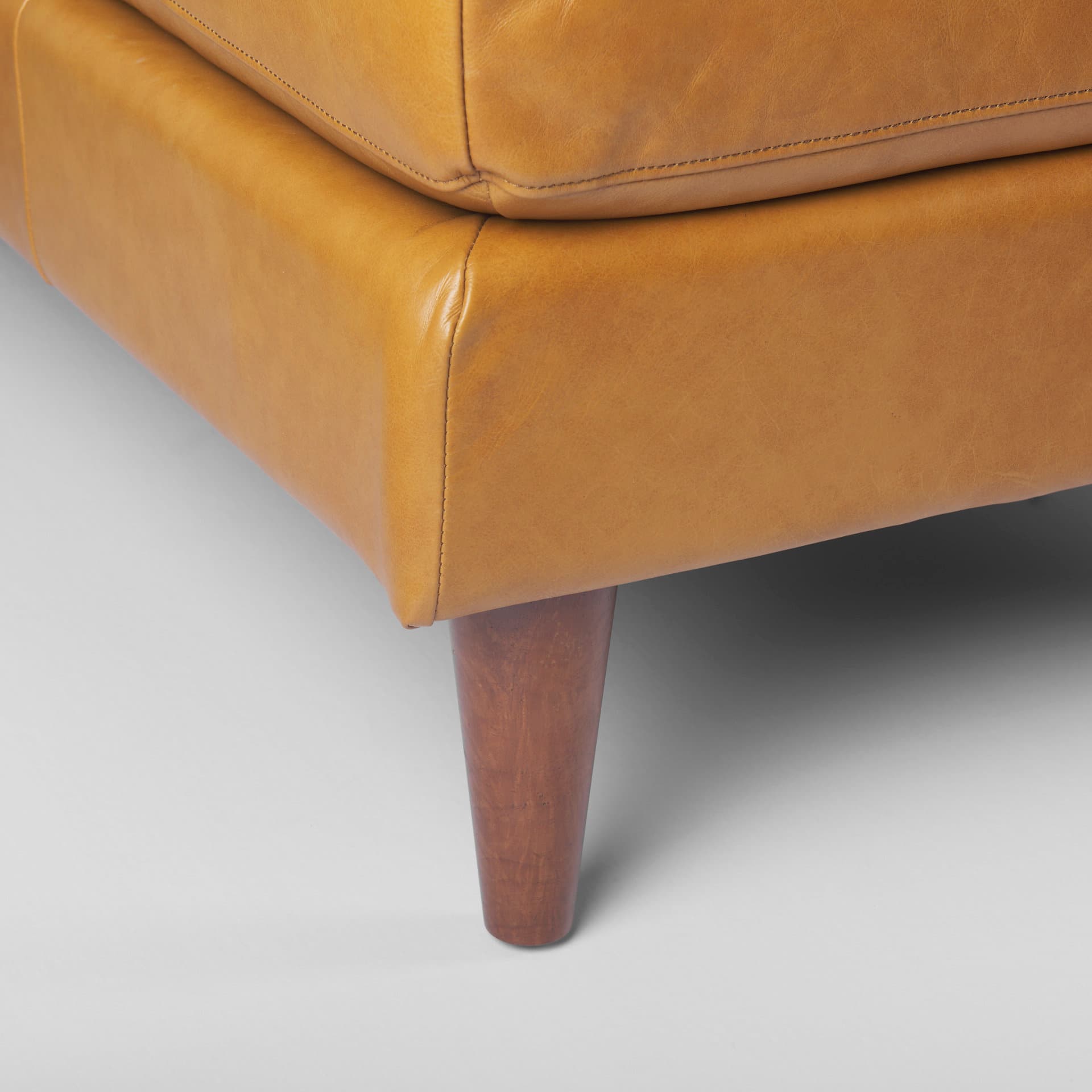 Svend 111.4L x 68.0W x 33.9H Tan Leather Left Chaise Sectional Sofa — product photograph