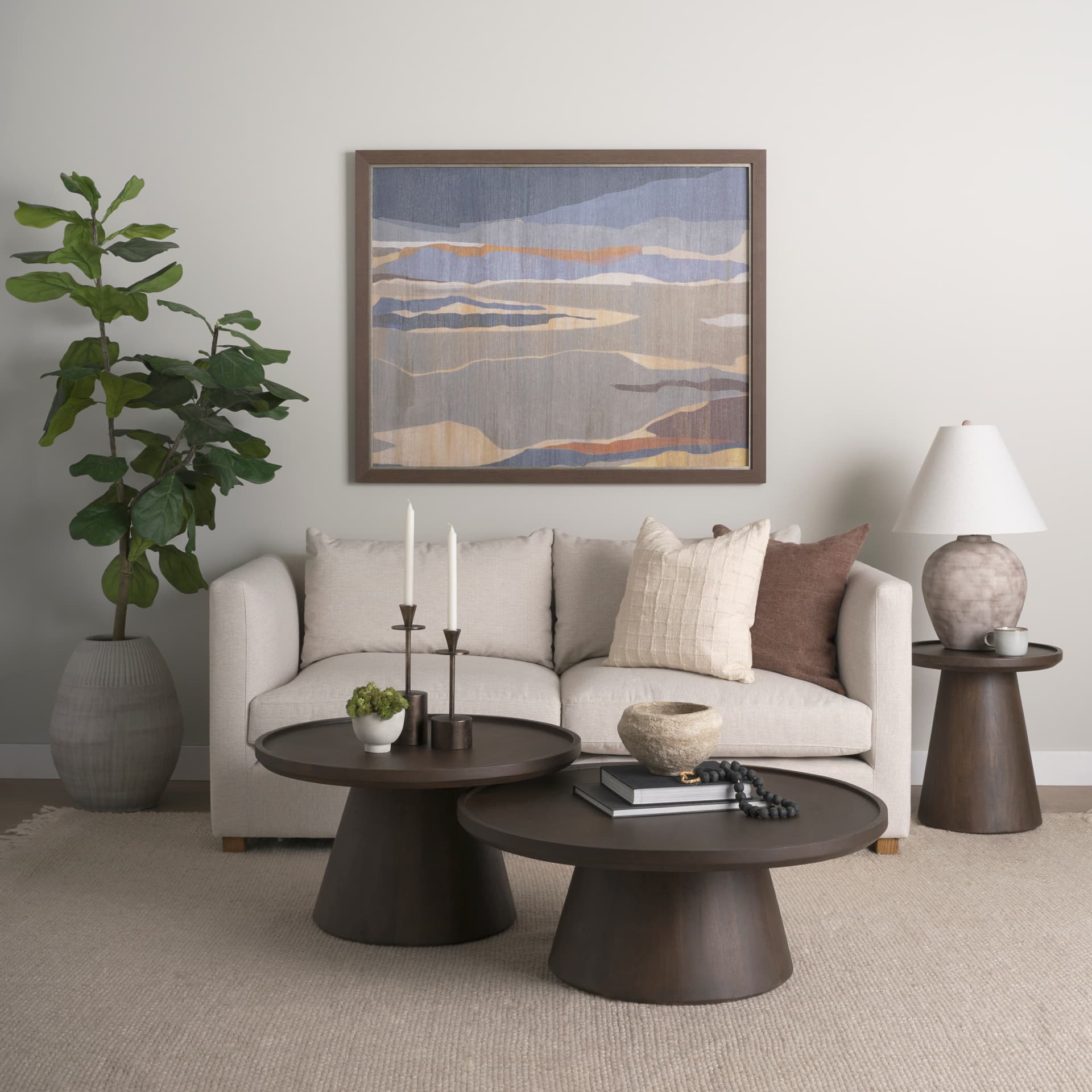 Takoda Dark Brown Wood Tapered Drum Nesting Coffee Tables — in a styled room