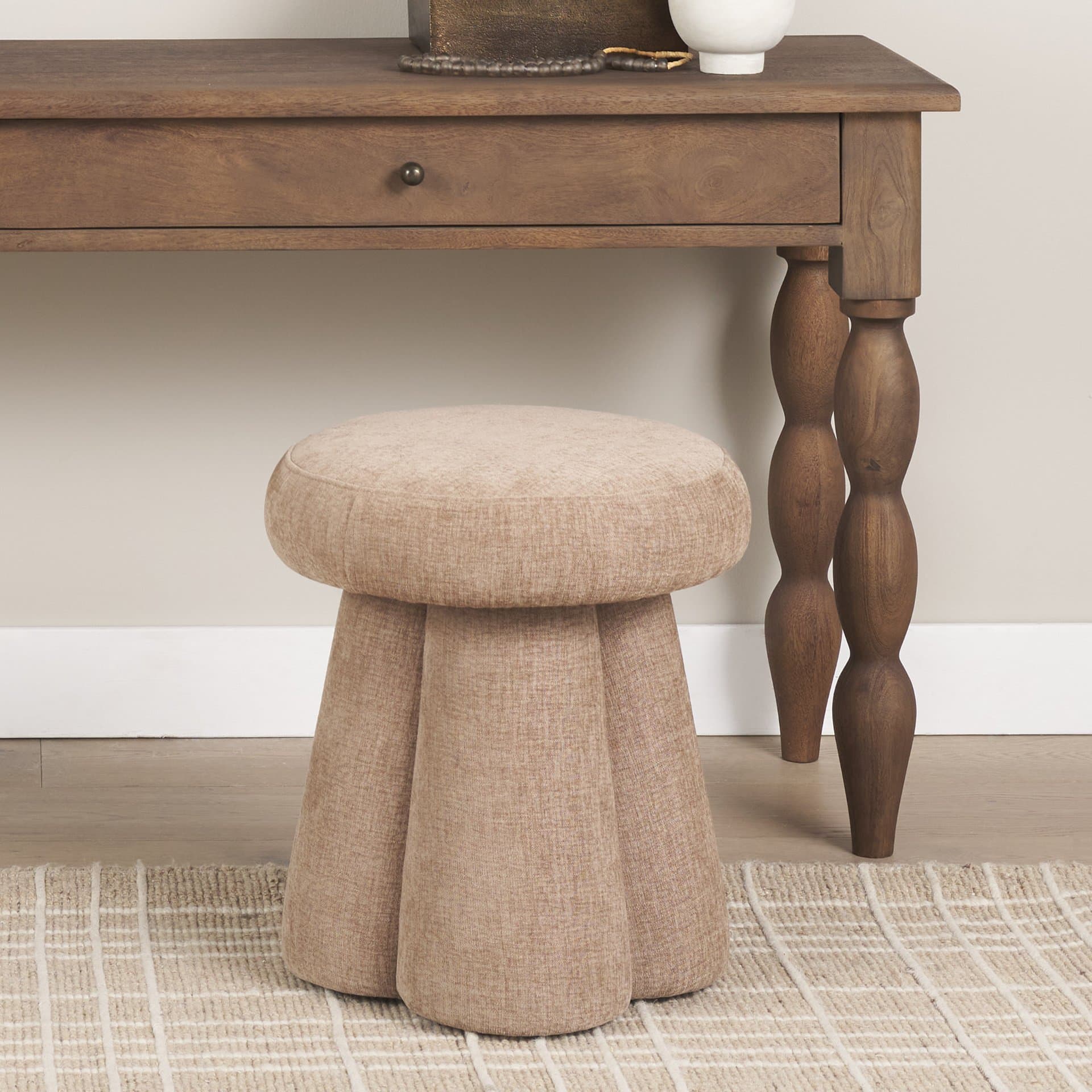 Oona Upholstered Ottoman | Stonewashed Latte Fabric | 3 Legs — in a styled room