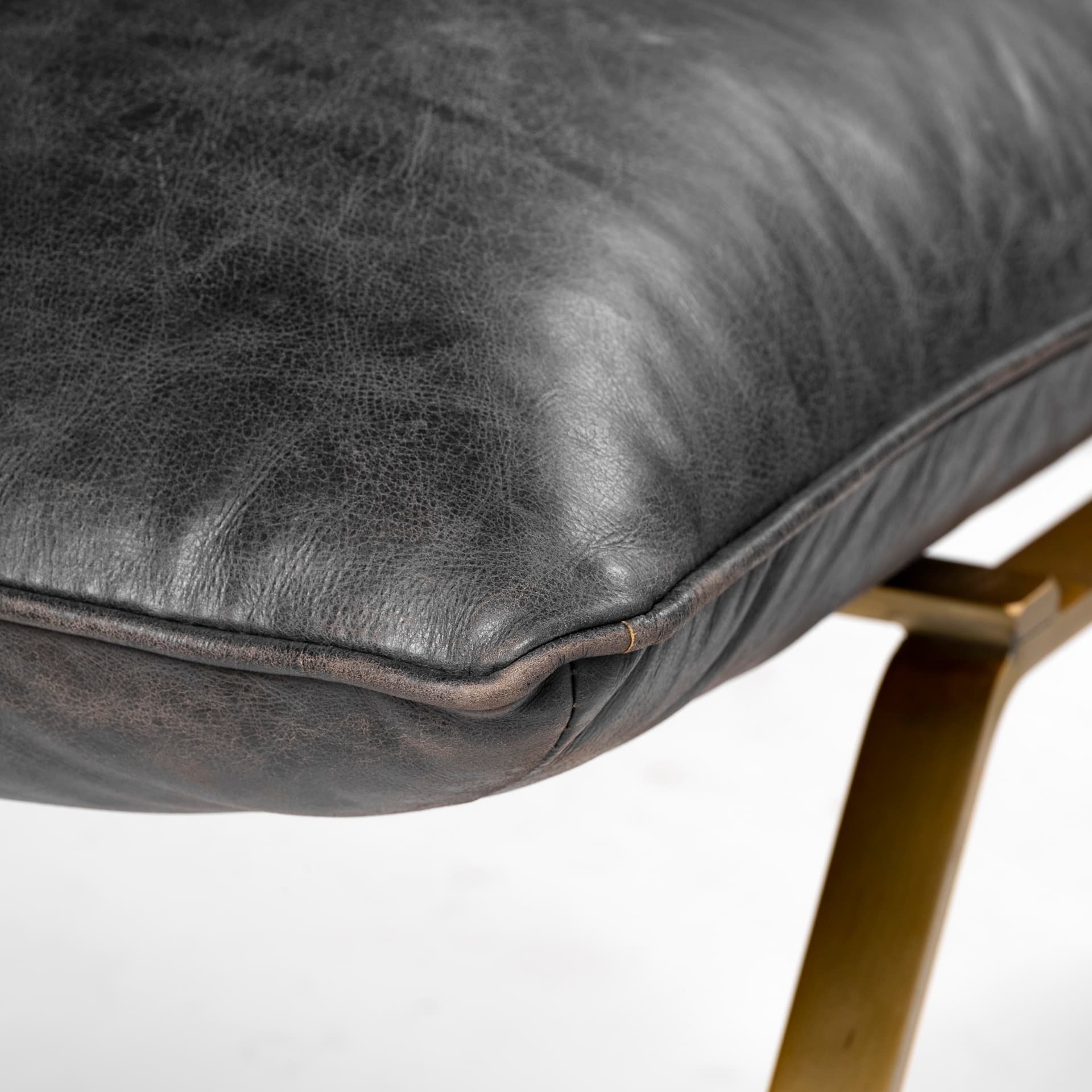 Flavelle II Black Leather Cushion Seat and Solid Iron Base Accent Chair — product photograph