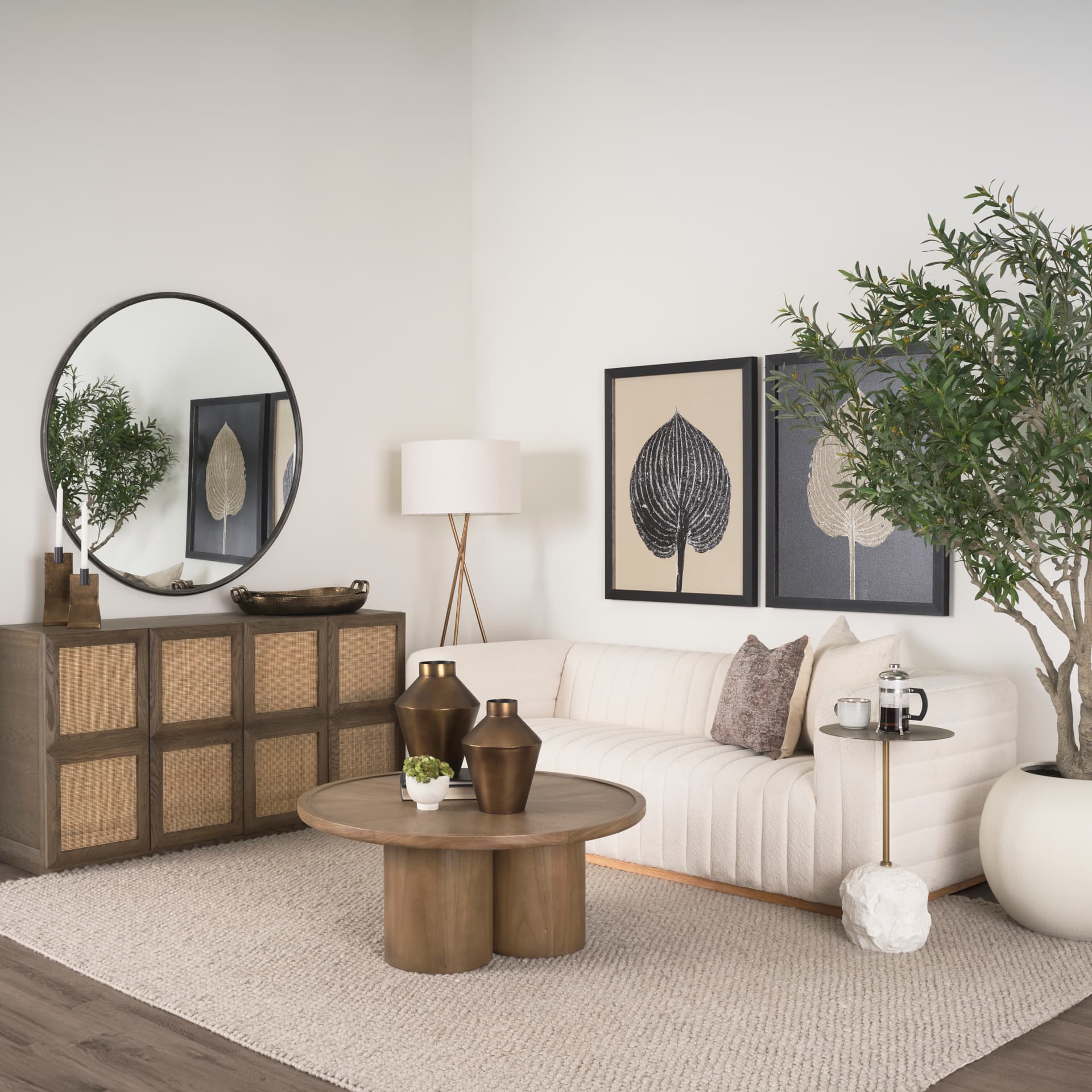 Tavi Medium Brown Round Coffee Table — in a styled room